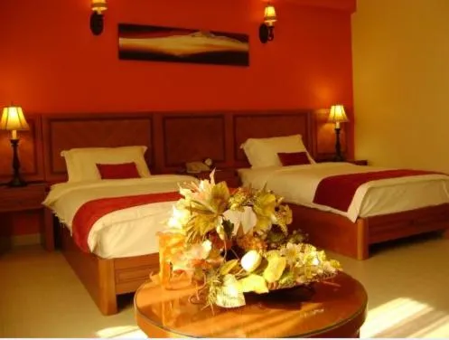 Bed in La Rosa Hotel Oman