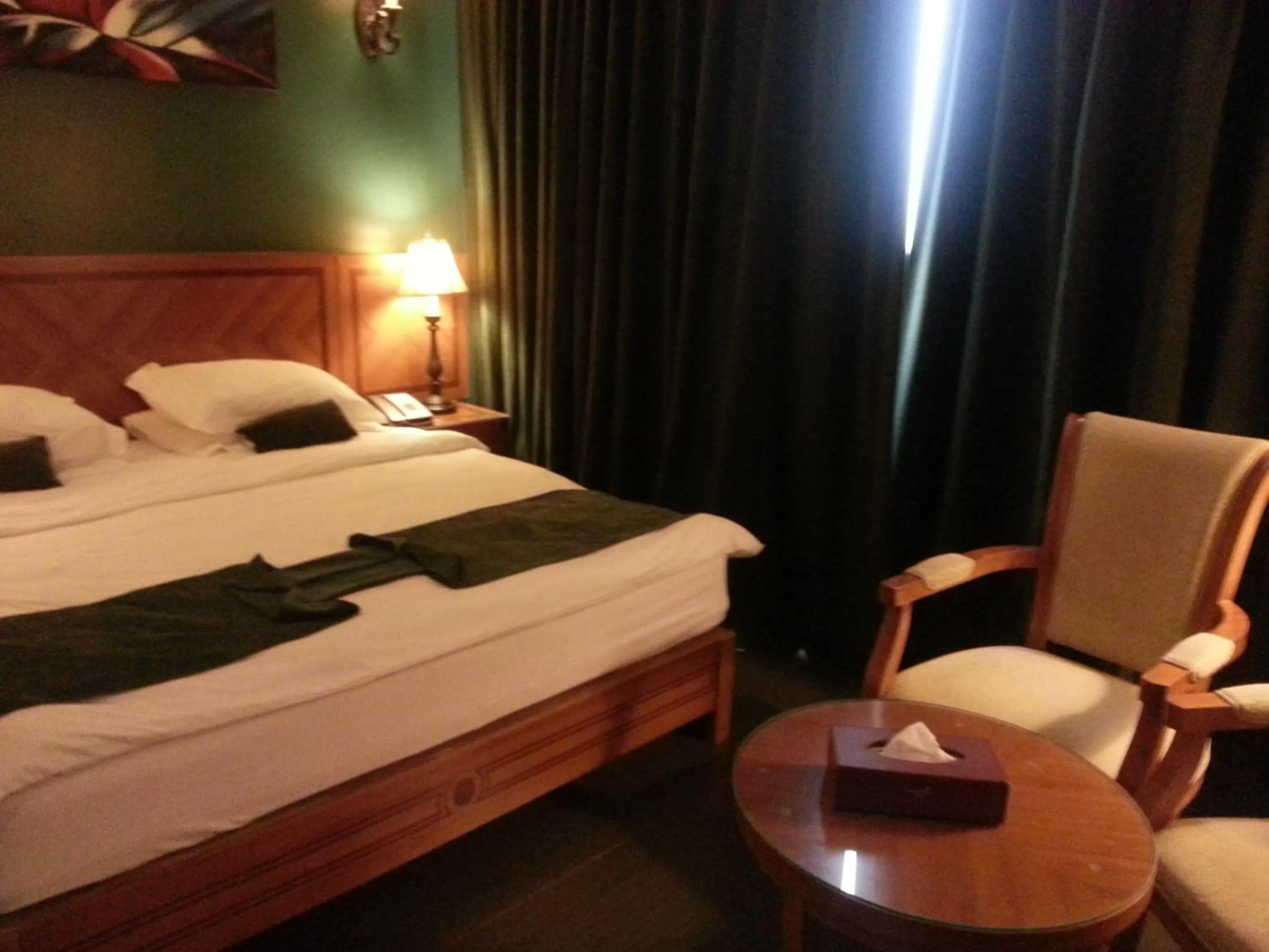 Bed in La Rosa Hotel Oman