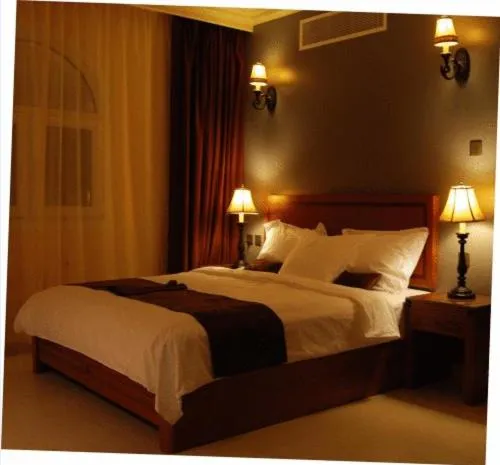 Bed in La Rosa Hotel Oman