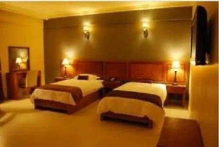 Bed in La Rosa Hotel Oman