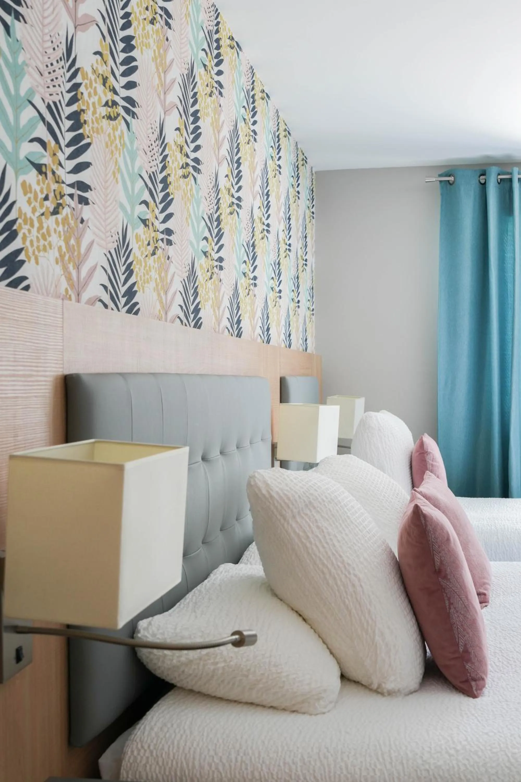 Bed in Logis Hôtel l'Amandier