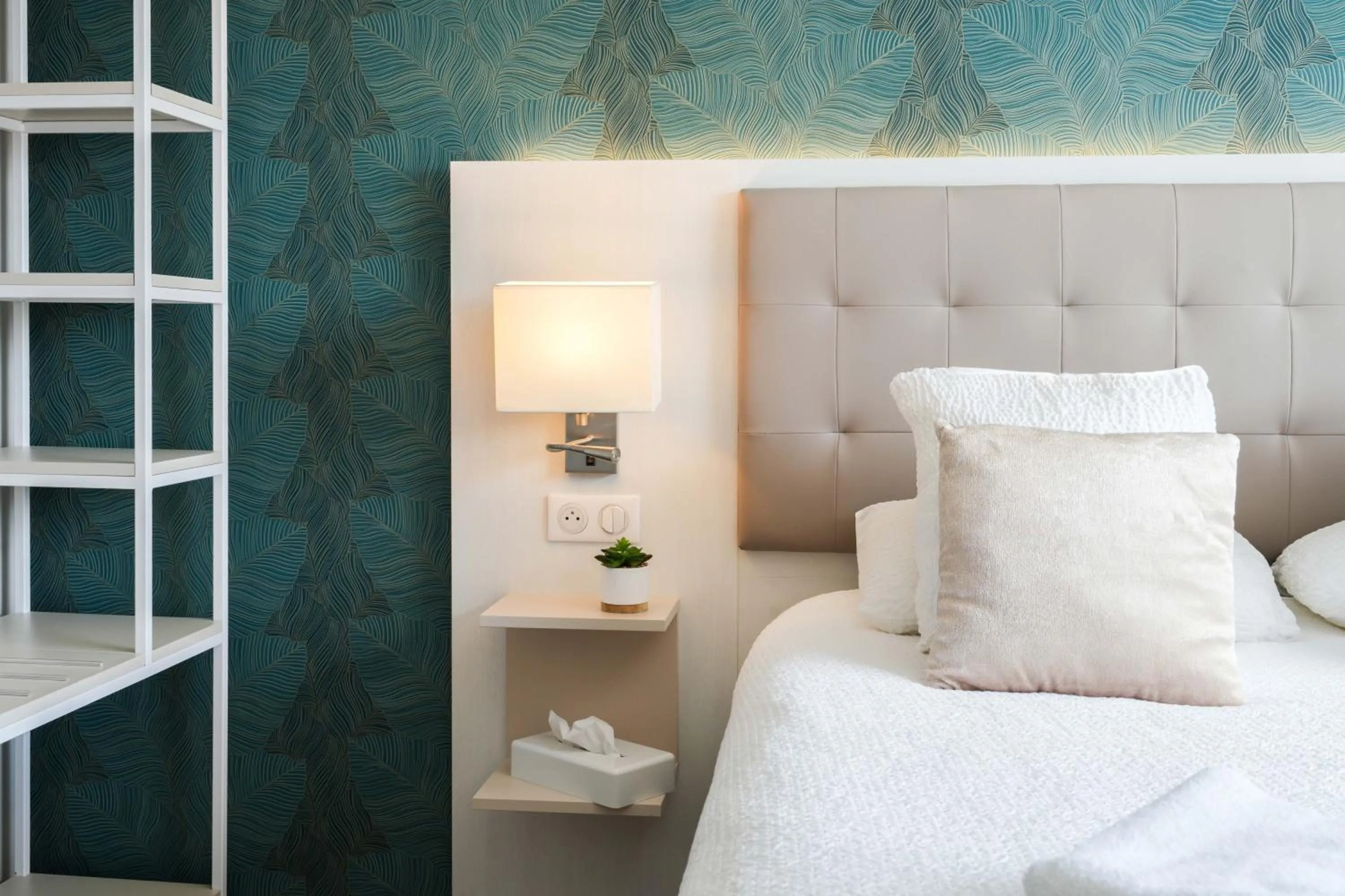 Bed in Logis Hôtel l'Amandier