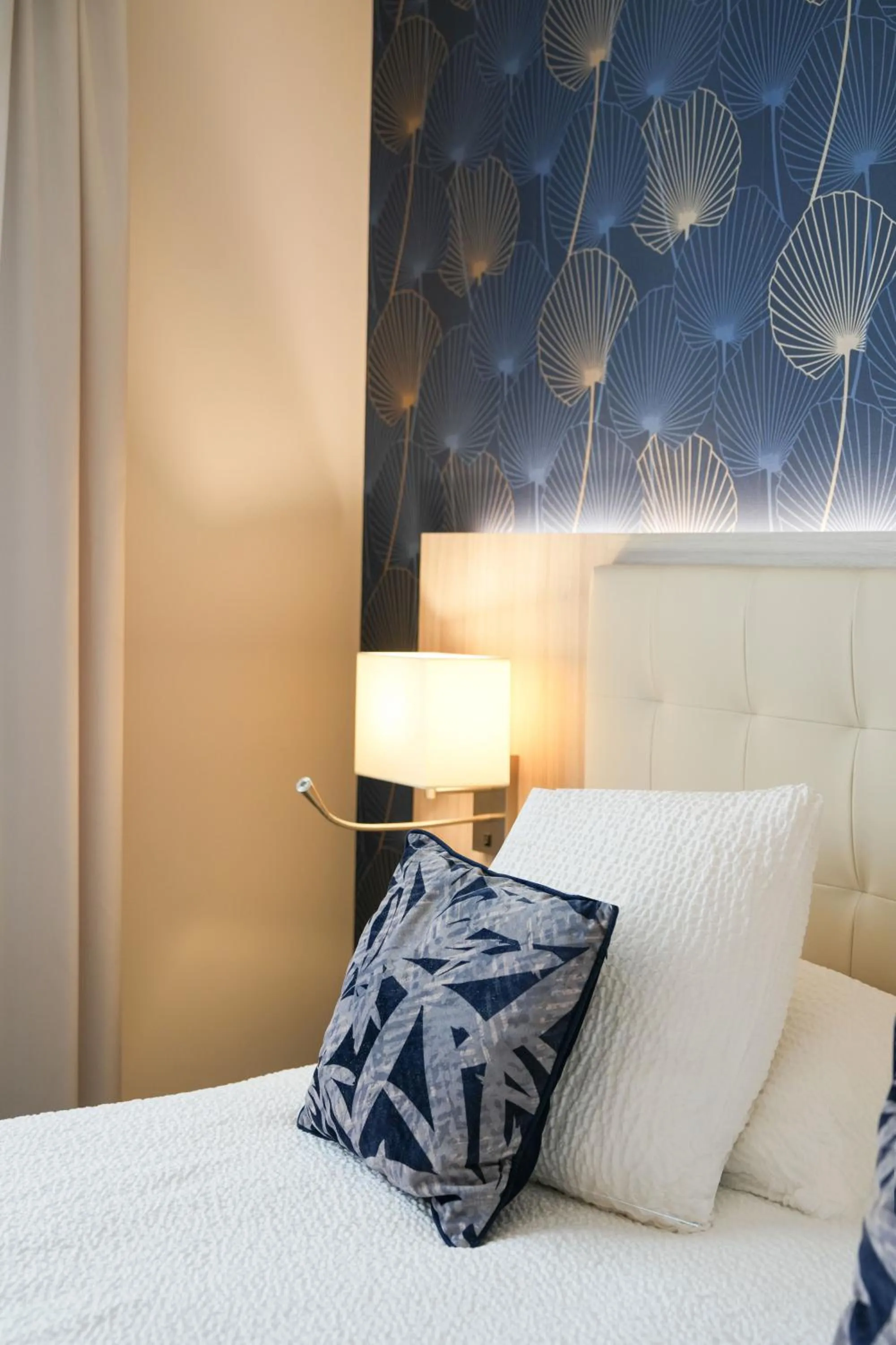 Bed in Logis Hôtel l'Amandier