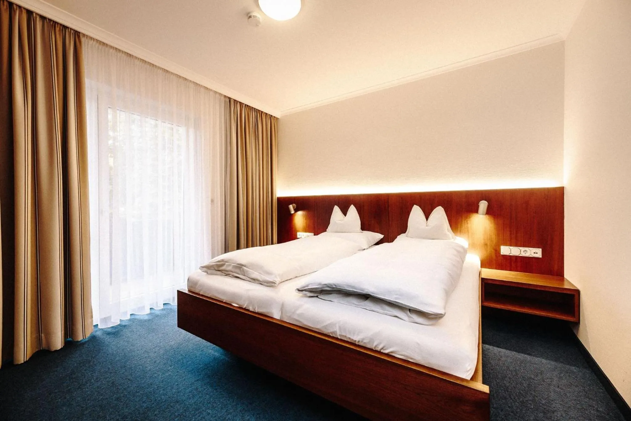 Bed in Hotel Reindl Suiten & Appartments