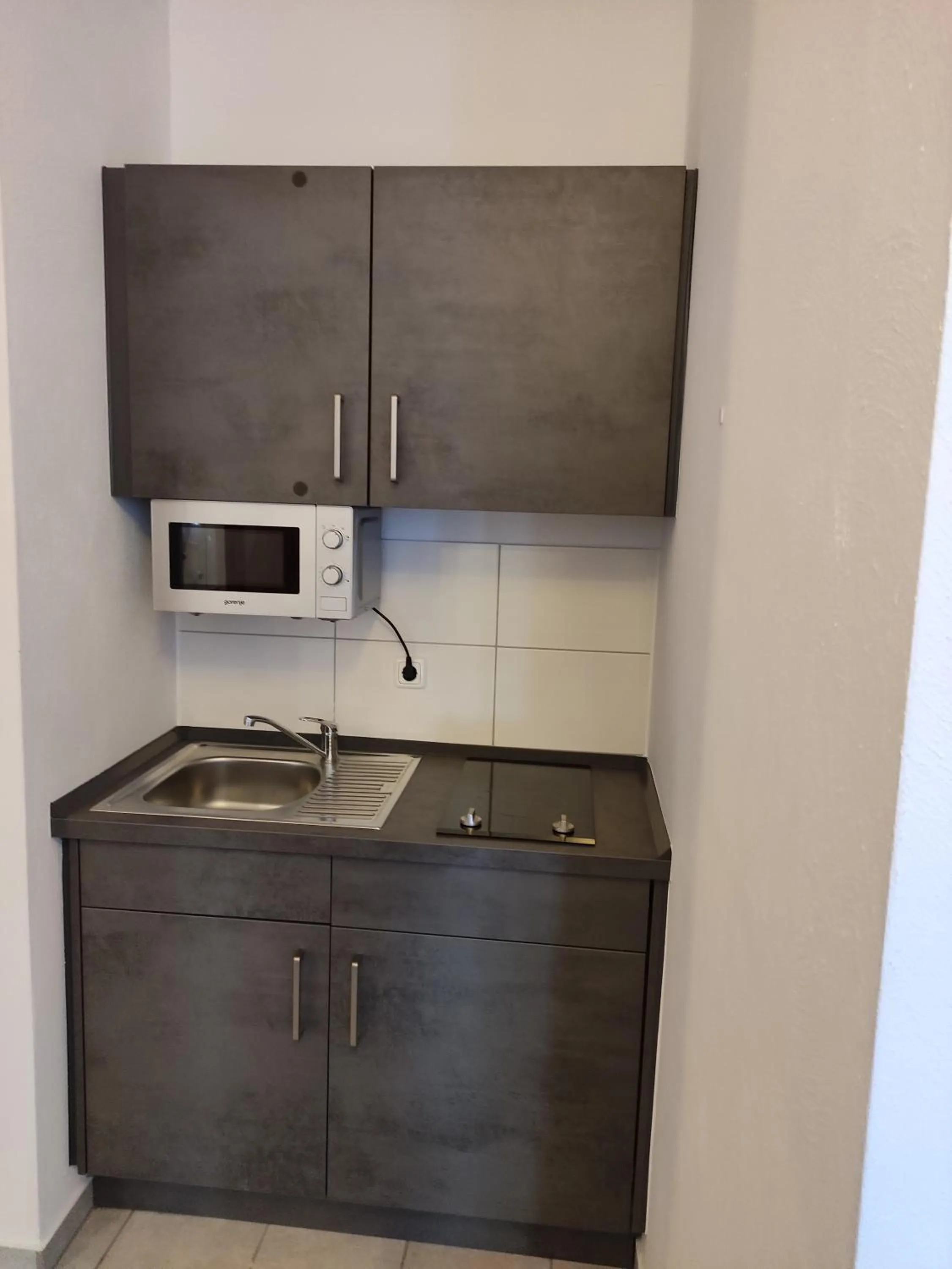 Kitchen or kitchenette in Appart-Hotel Harmonie