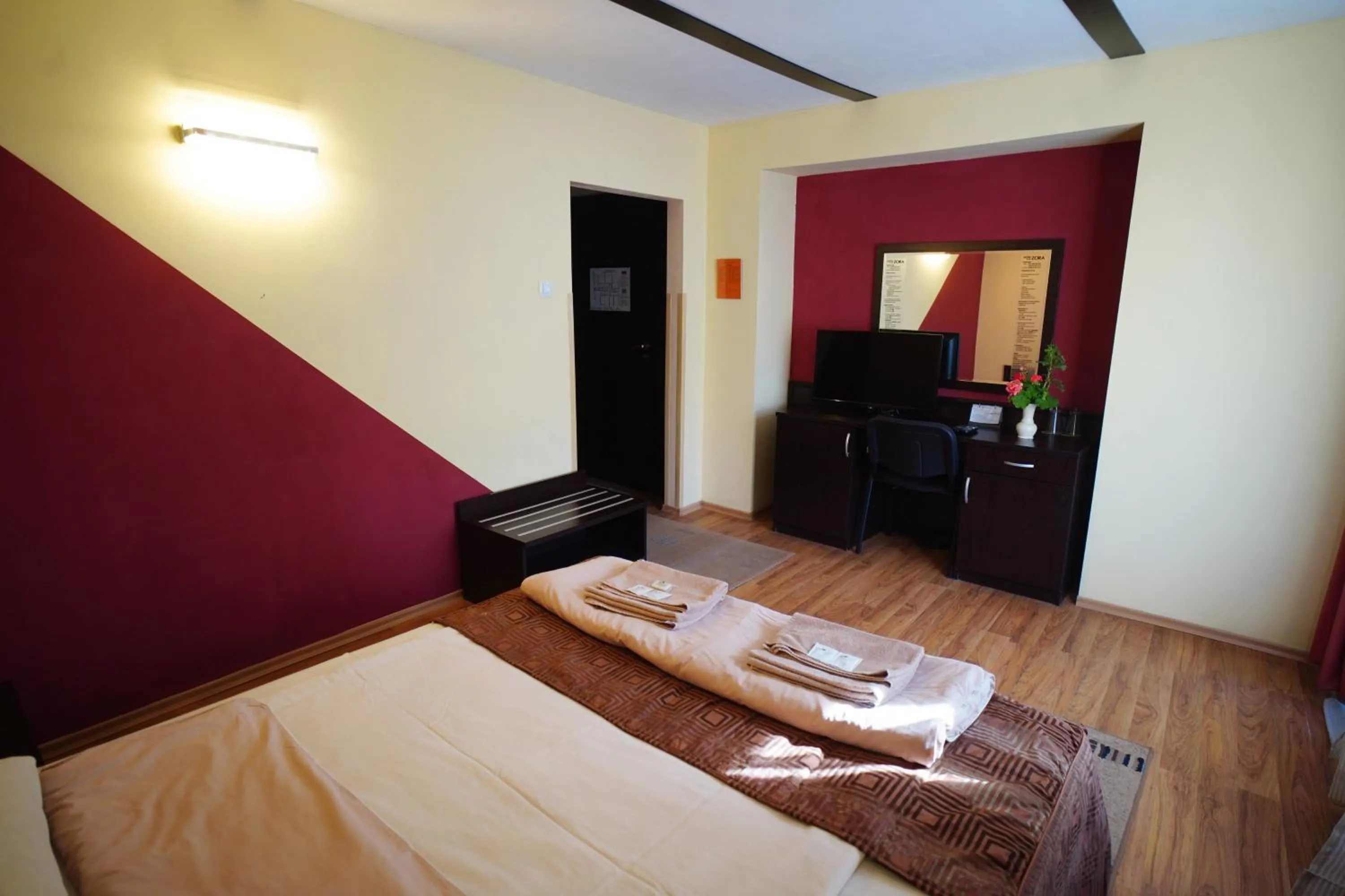 Bed in Family Art-Hotel Zora