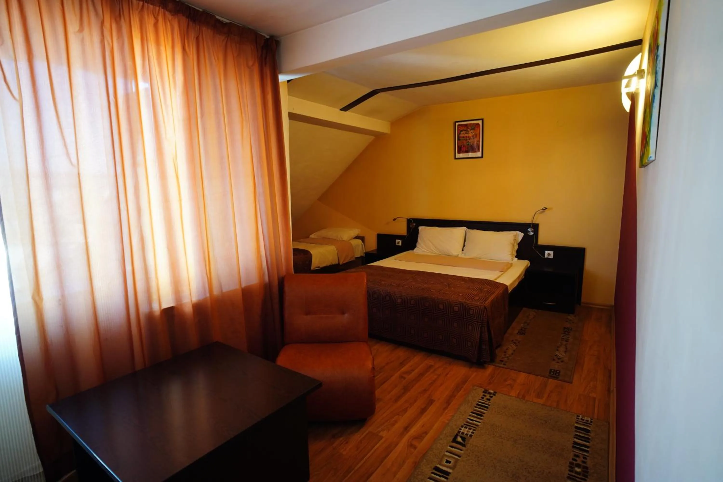 Bed in Family Art-Hotel Zora