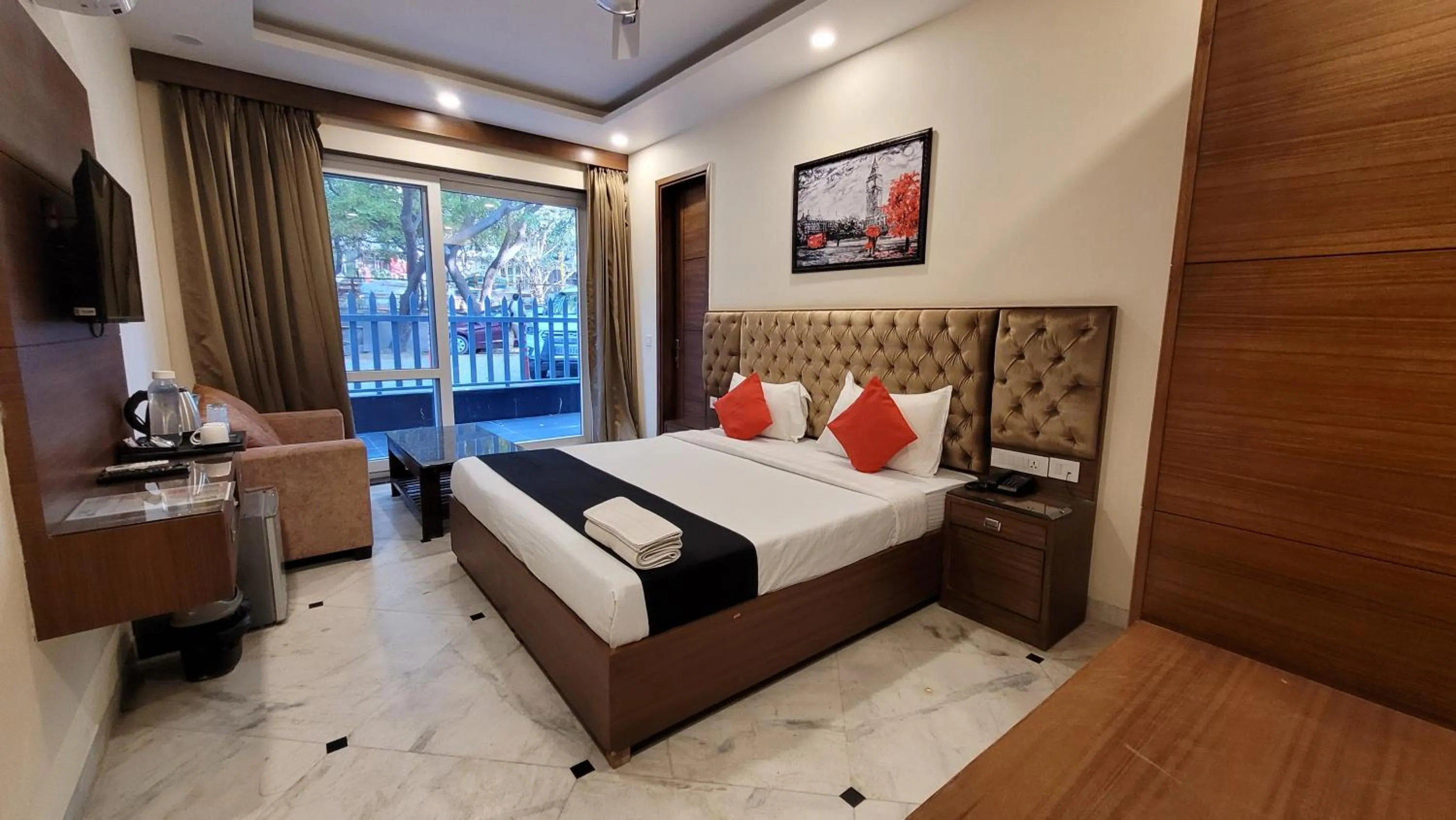 Photo of the whole room, Bed in JMD Residency