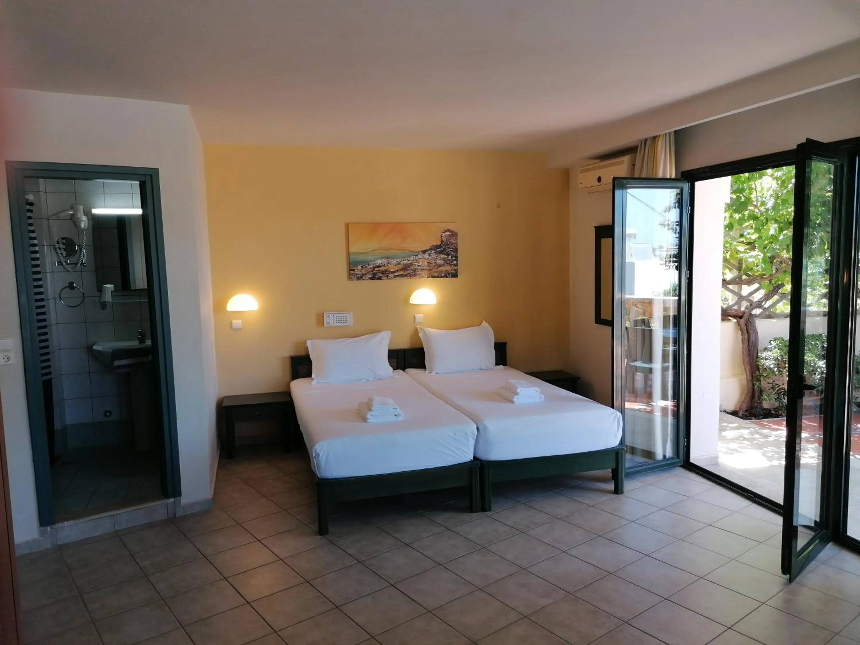 Bed in Villiana Holiday Apartments