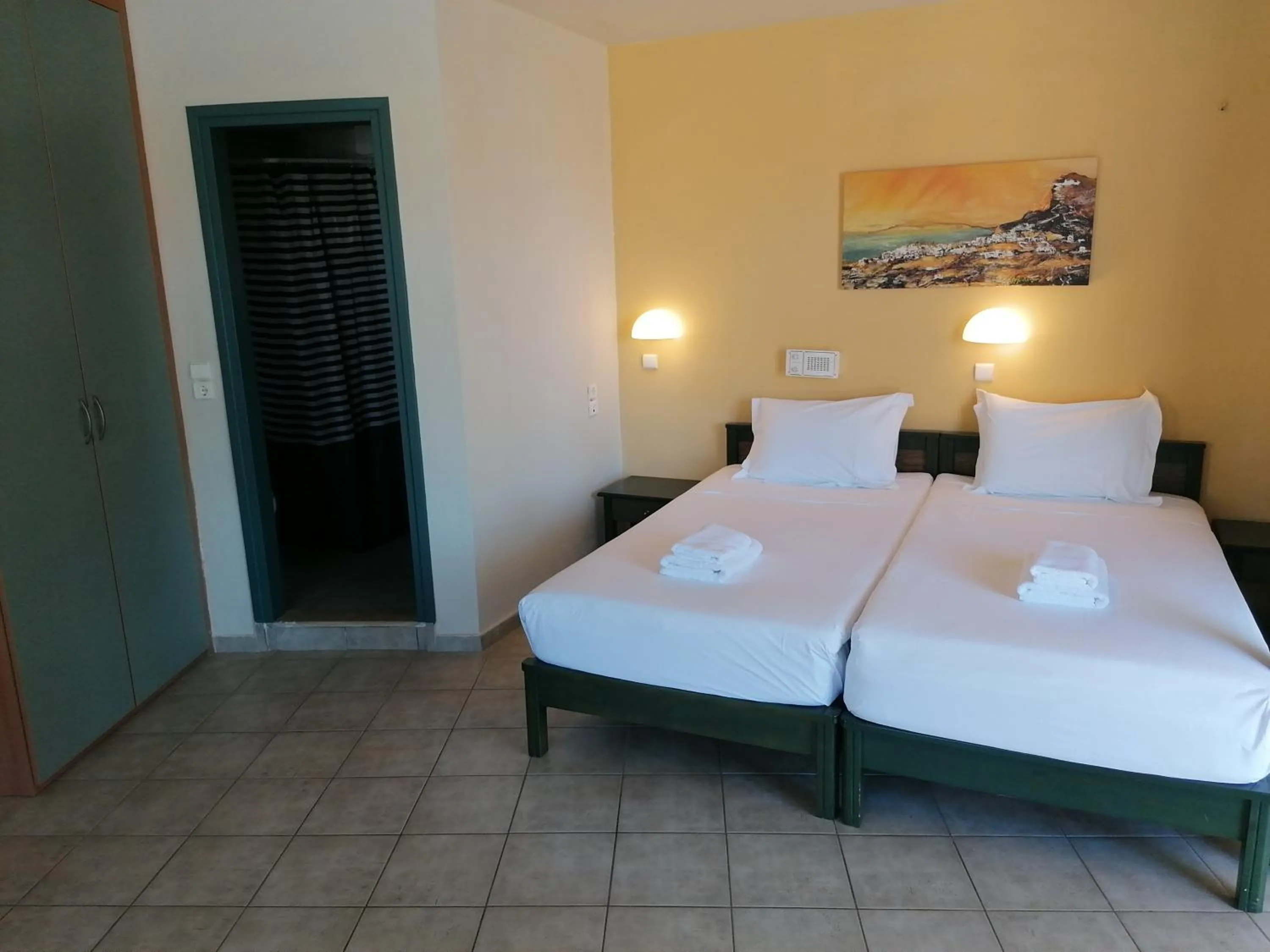 Bed in Villiana Holiday Apartments