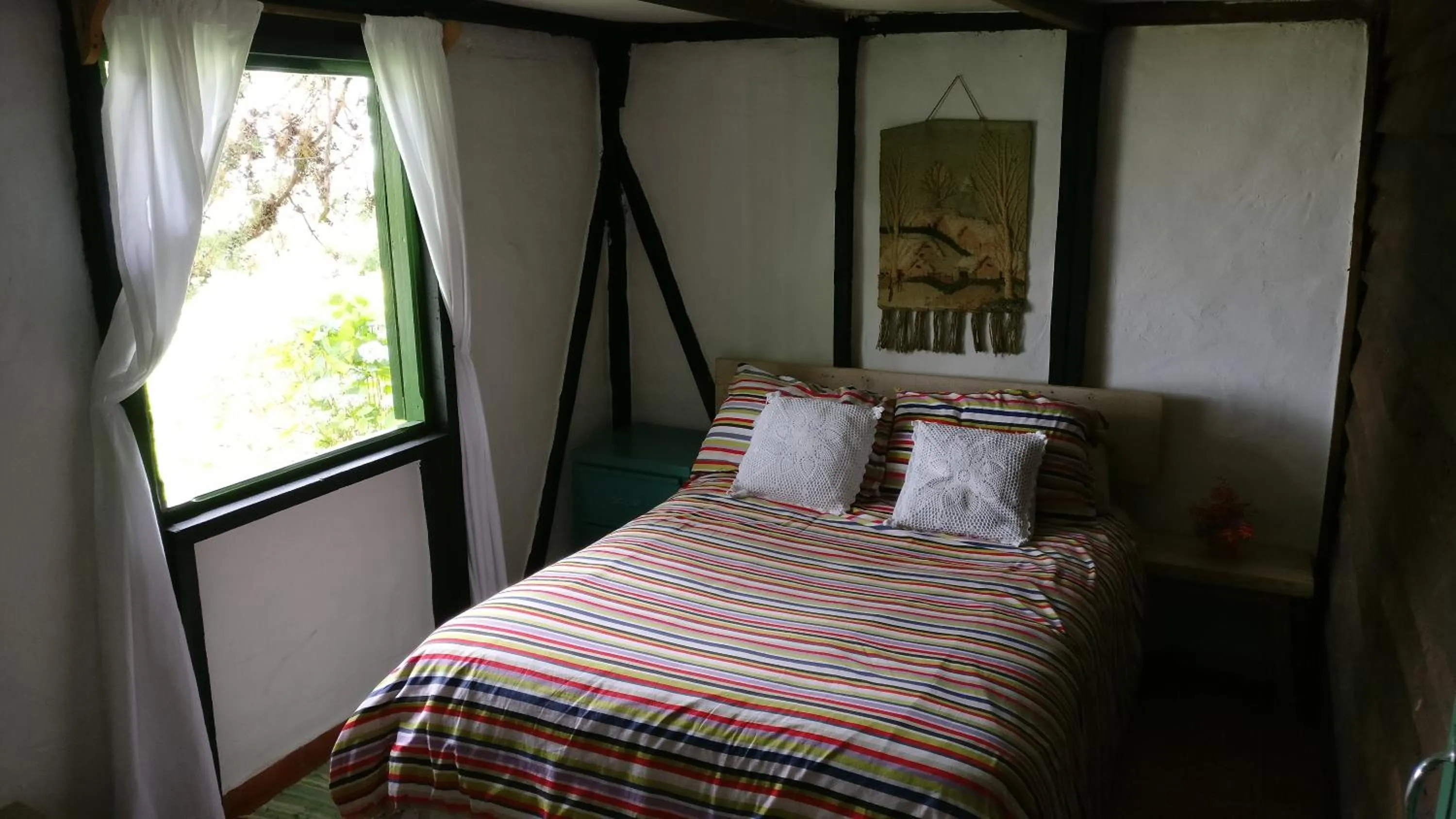 Bed in Villa Pajon Eco Lodge