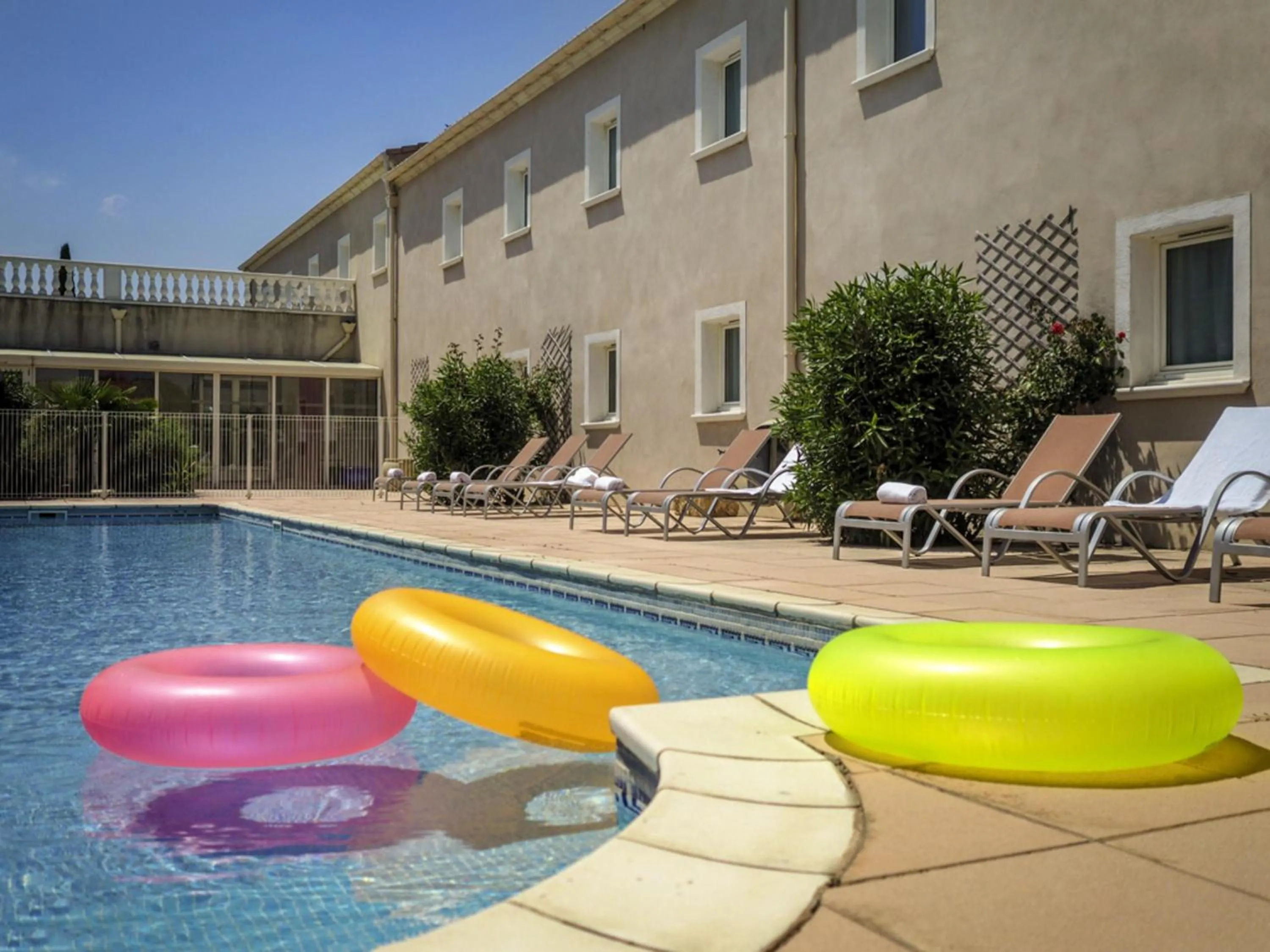 Pool view in ibis Orange Sud