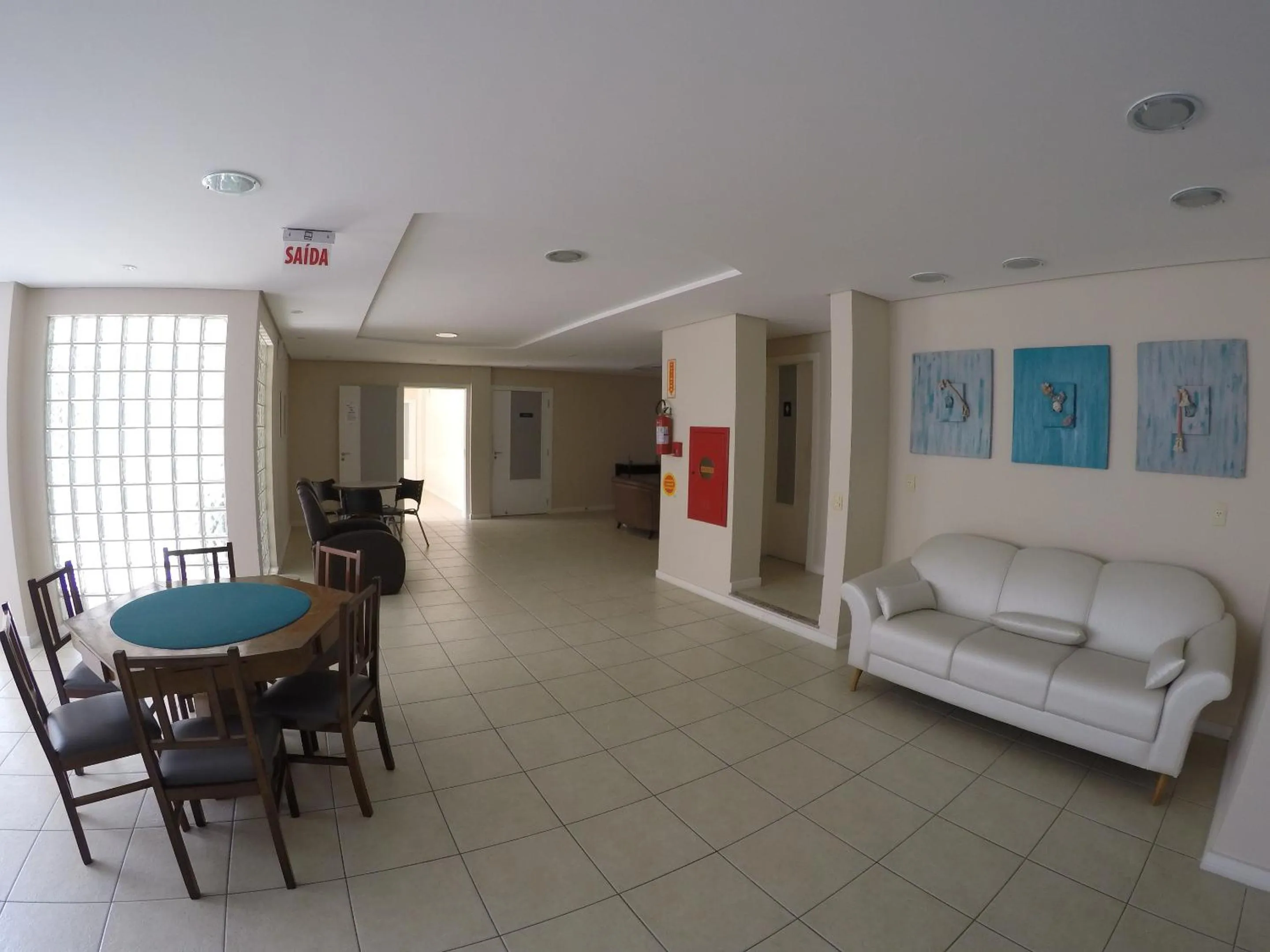 Communal lounge/ TV room in Joaquina Beach Hotel