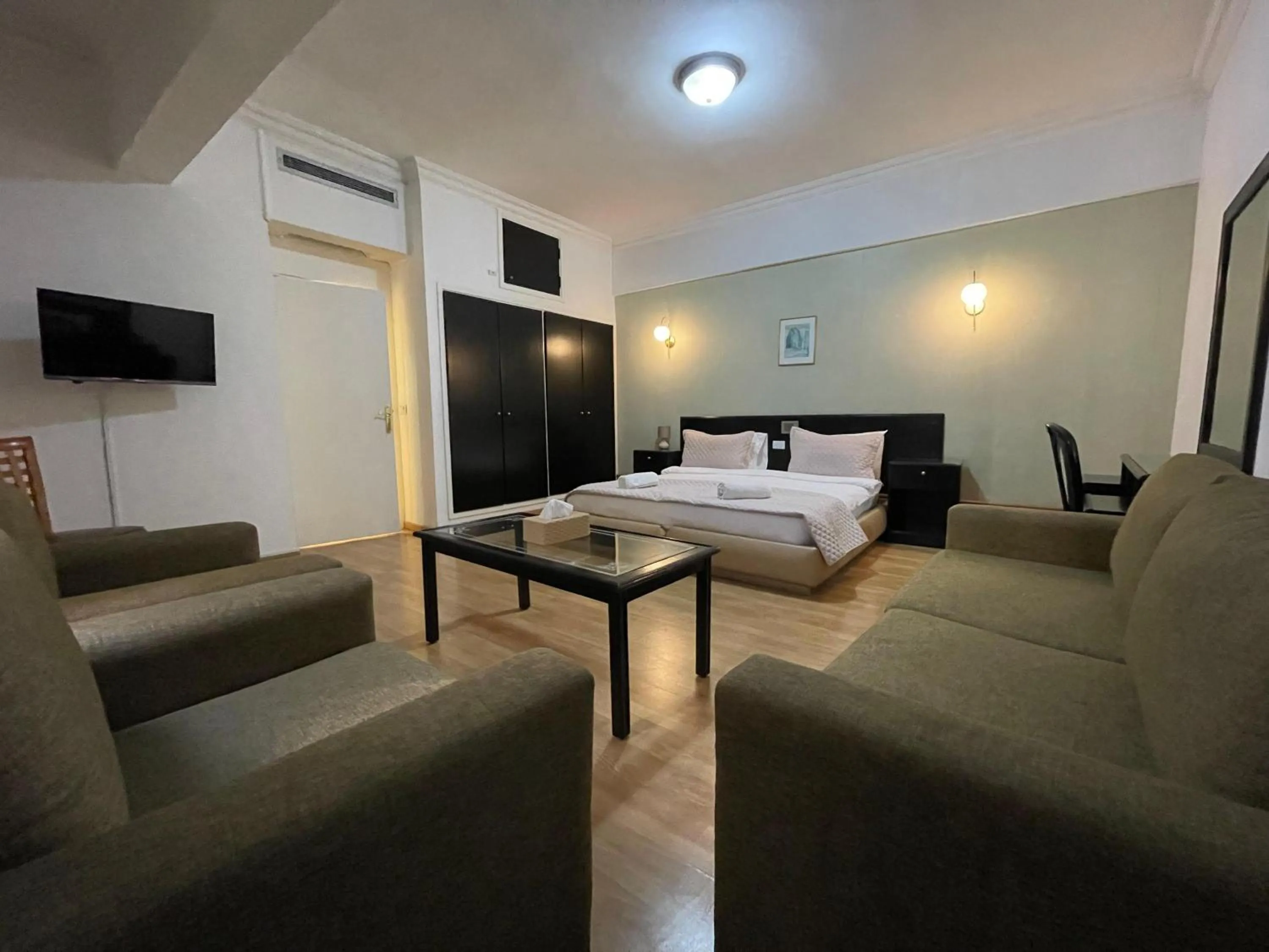 Living room, Bed in Elegant Suites Beirut