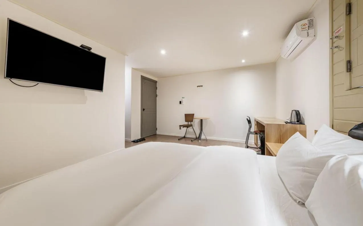 Bed in HOTEL YaJa WestGate