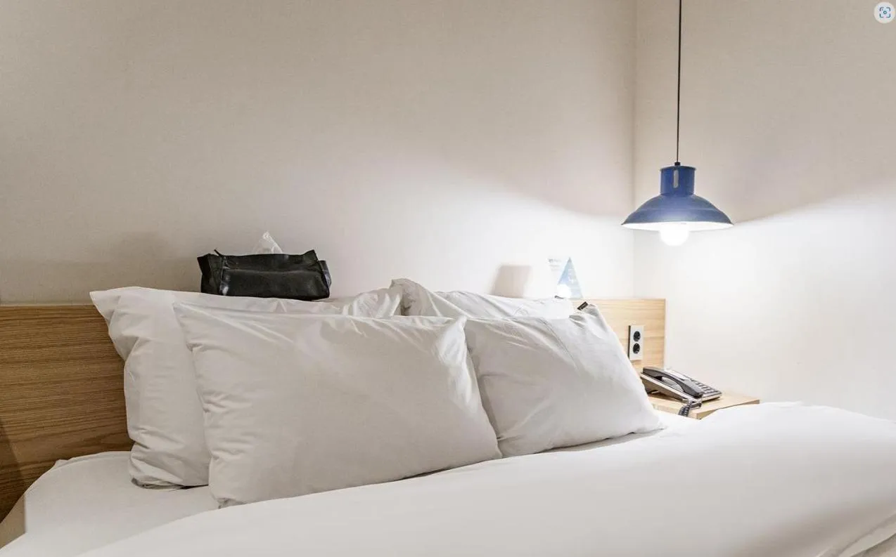 Bed in HOTEL YaJa WestGate