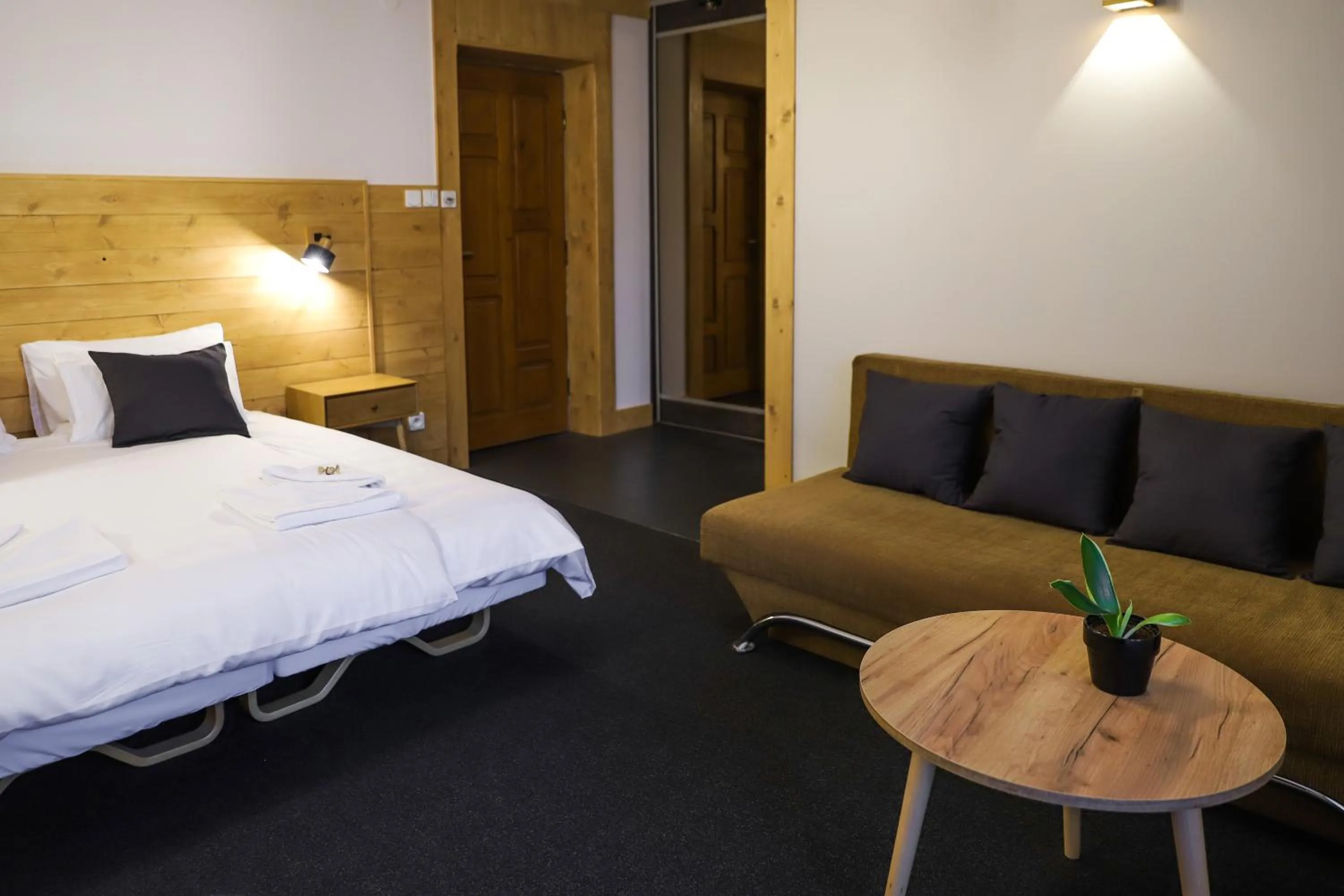 Seating area, Bed in Hotel Wysoka