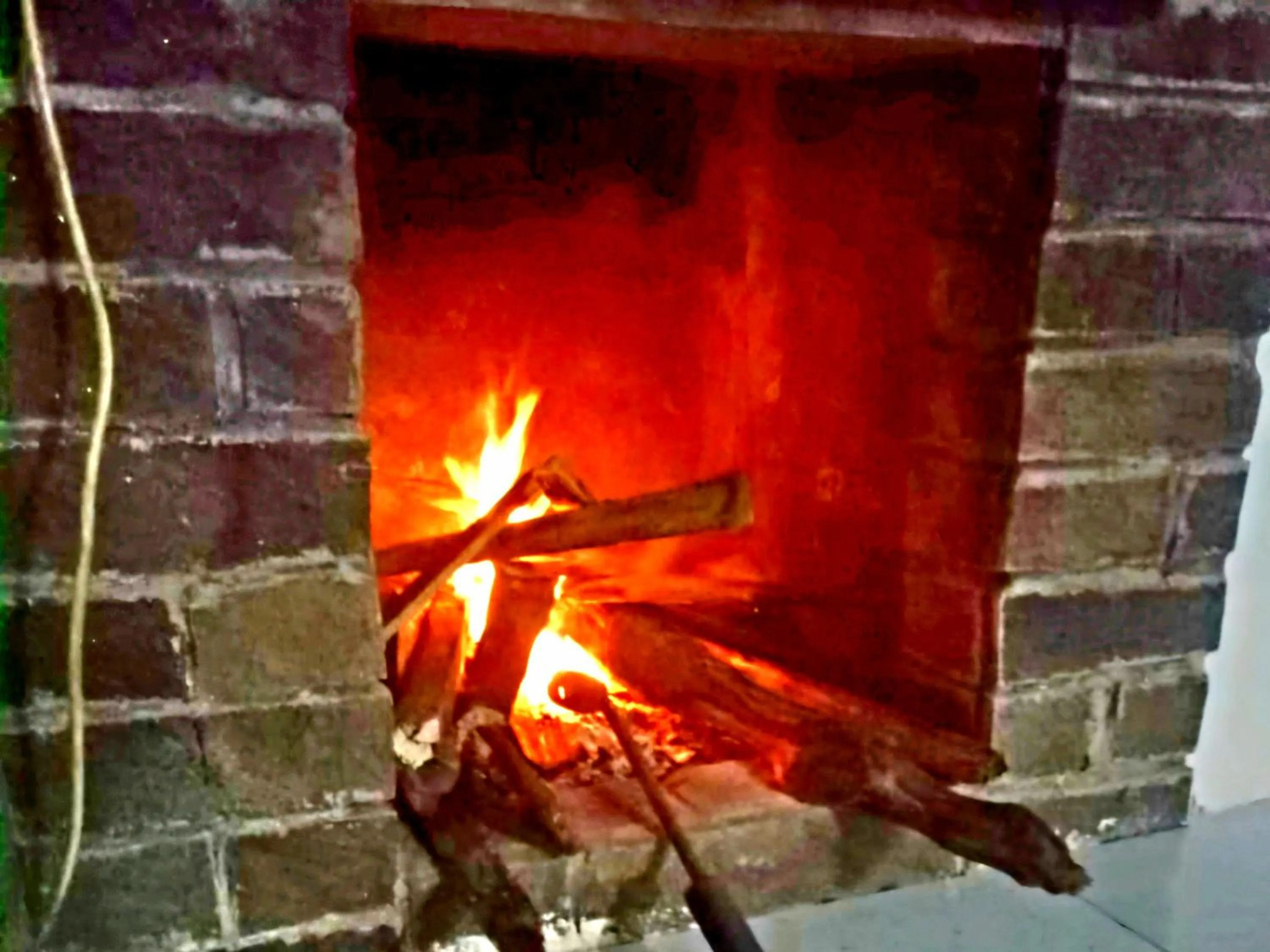 fireplace in Ciwidey Jungle Camp & Villa