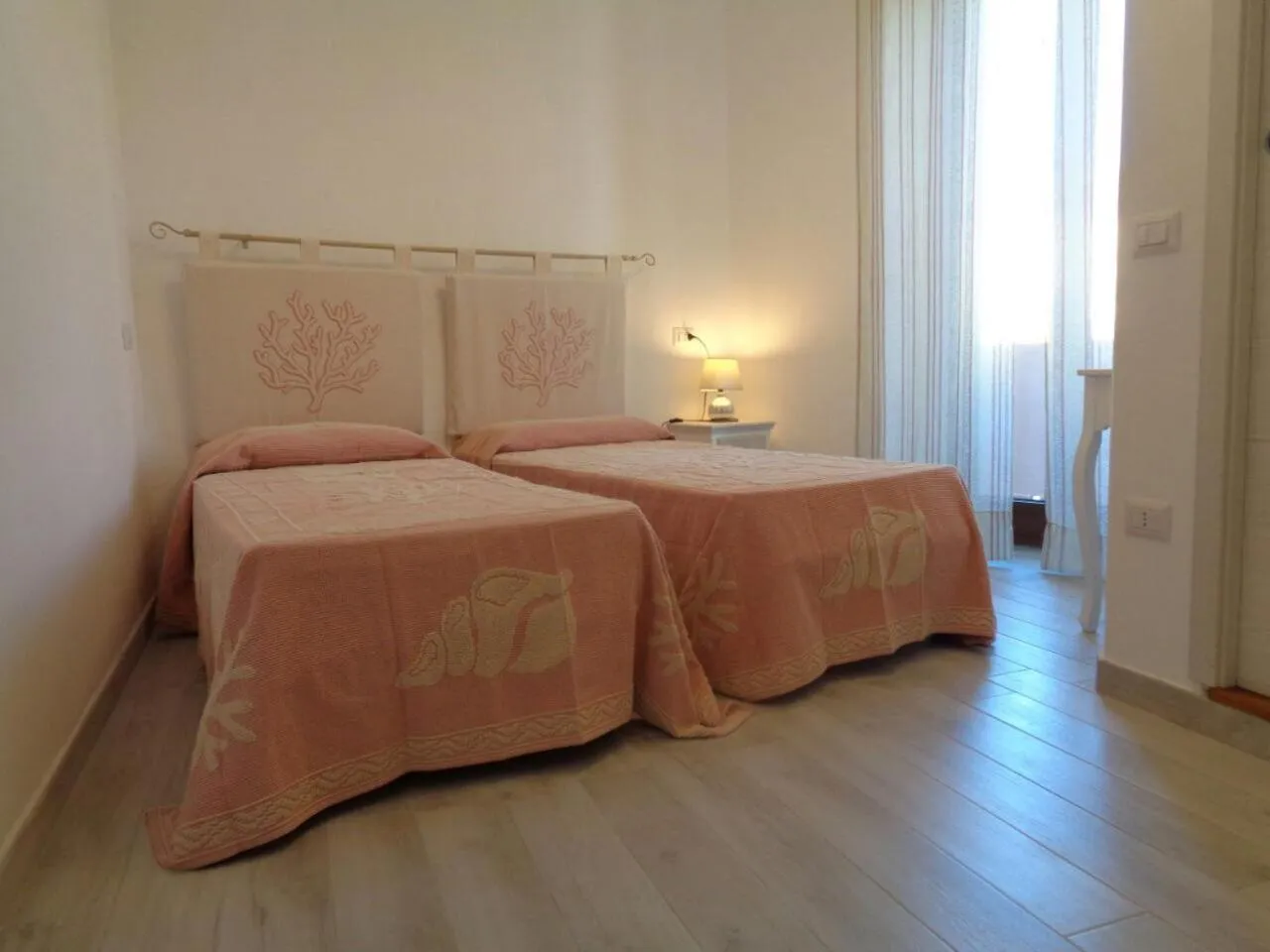 Bed in Sardinia-holiday Spargi Suite & Rooms