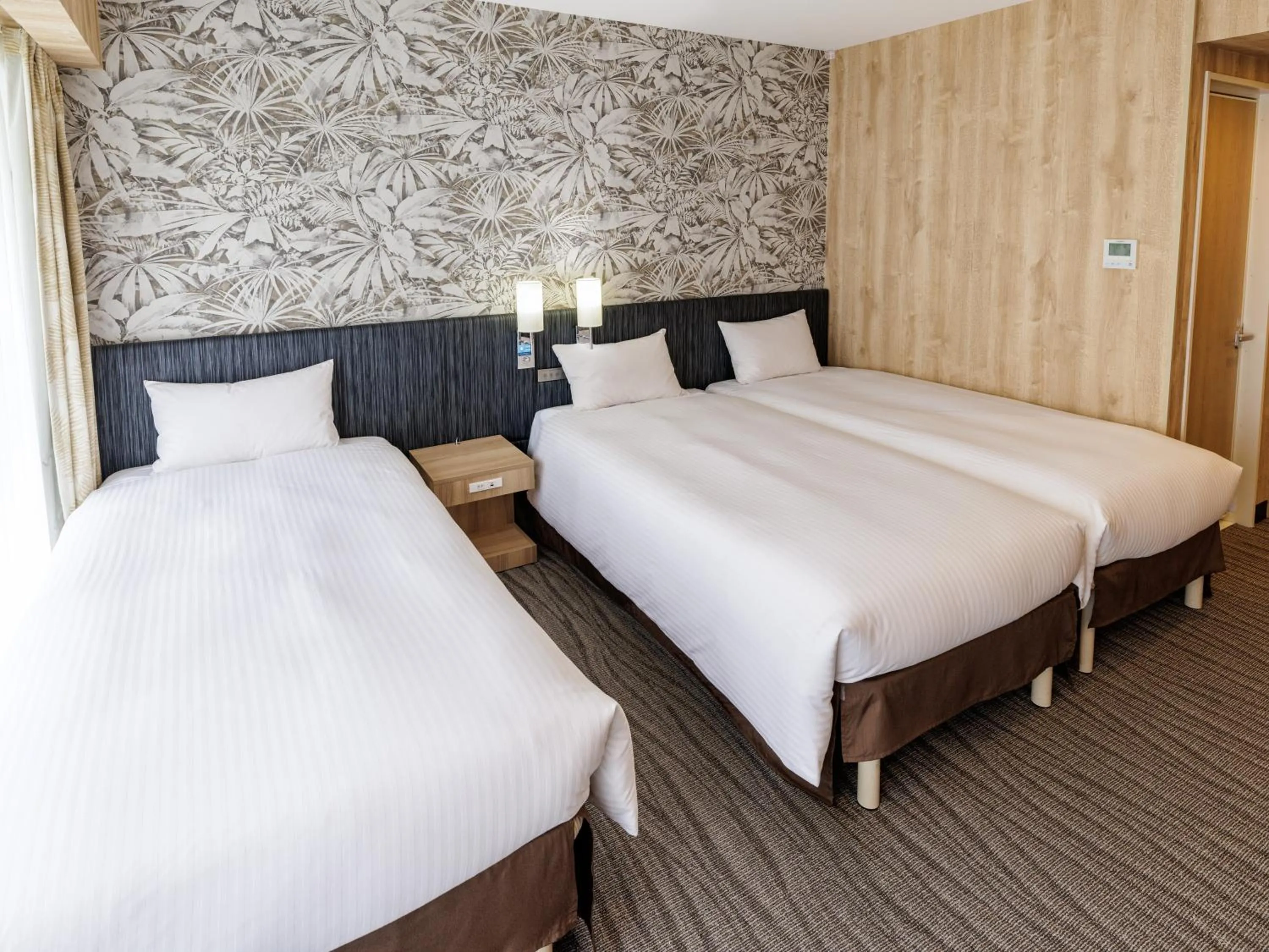 Bed in Nishitetsu Resort Inn Naha