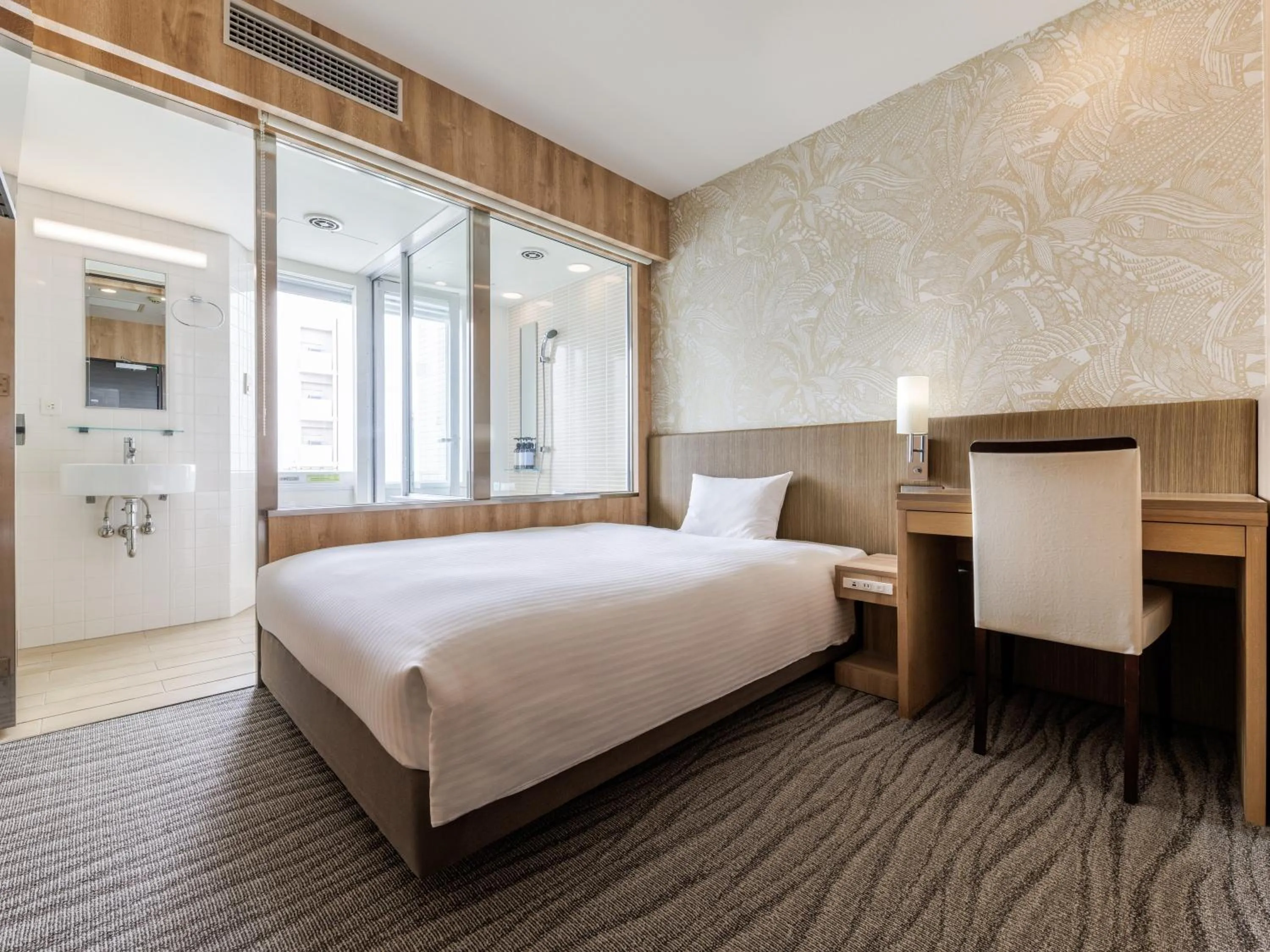 Bed in Nishitetsu Resort Inn Naha