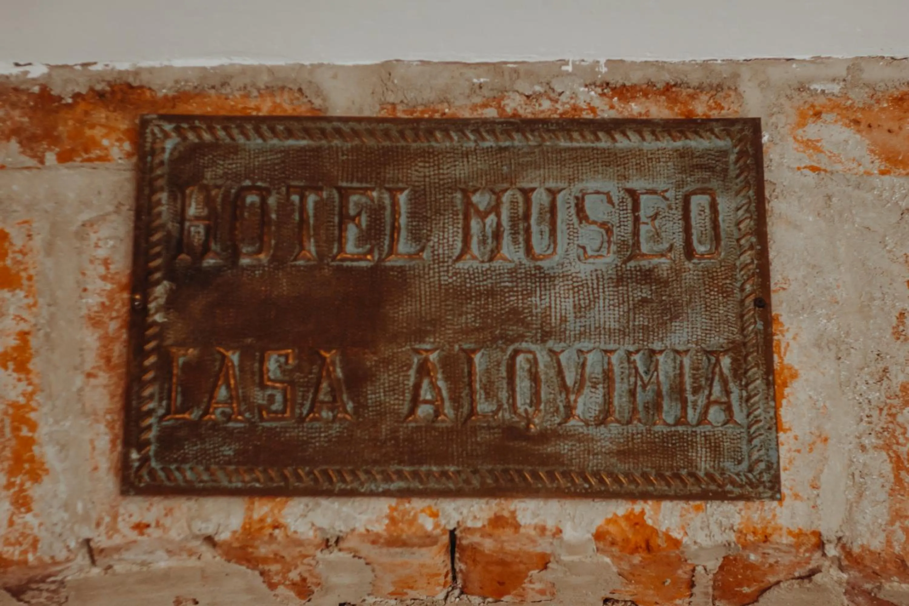 Property logo or sign in Hotel Casa Alquimia