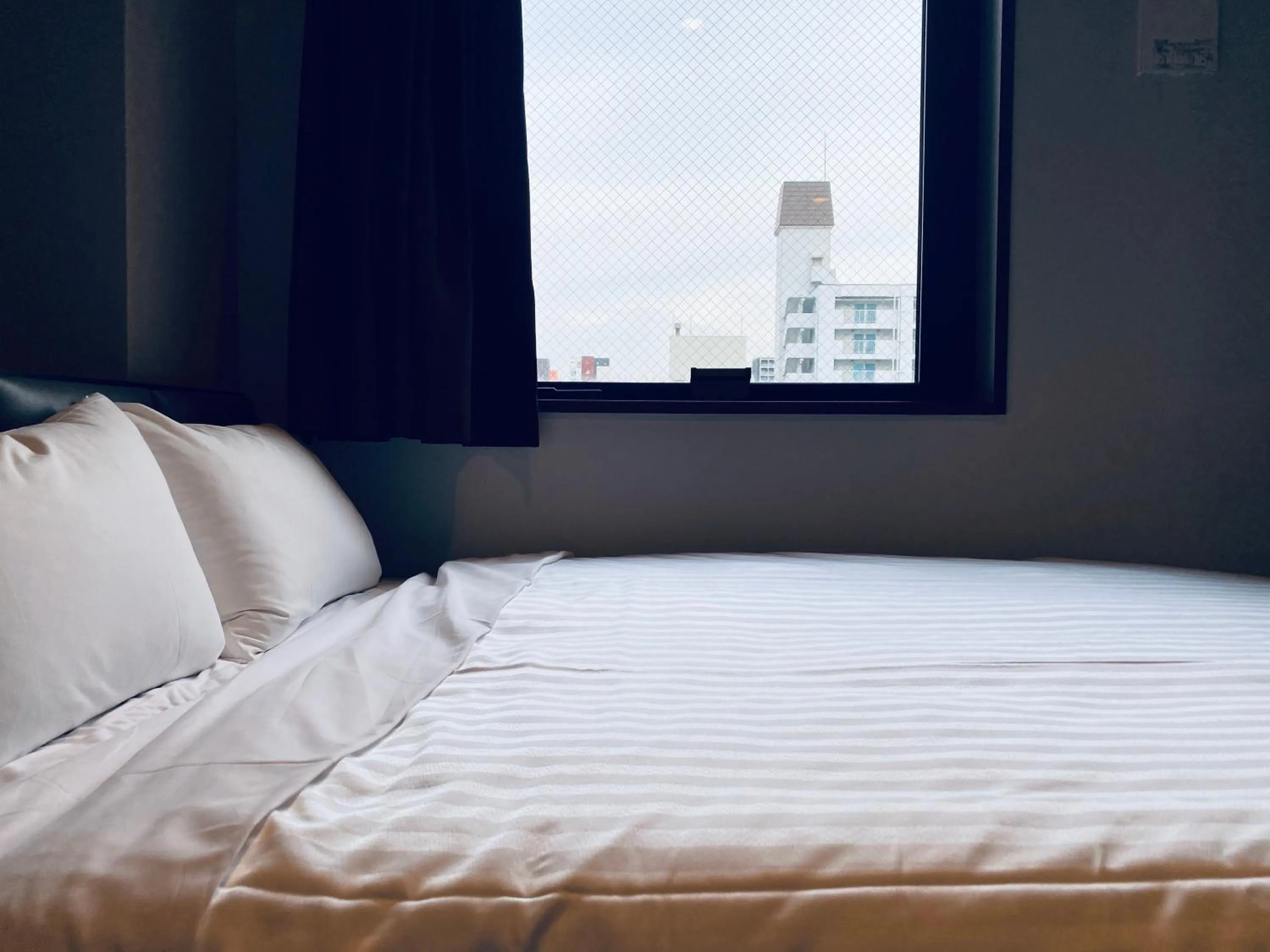 Bed in Hotel Hulaton Fukuokahakata