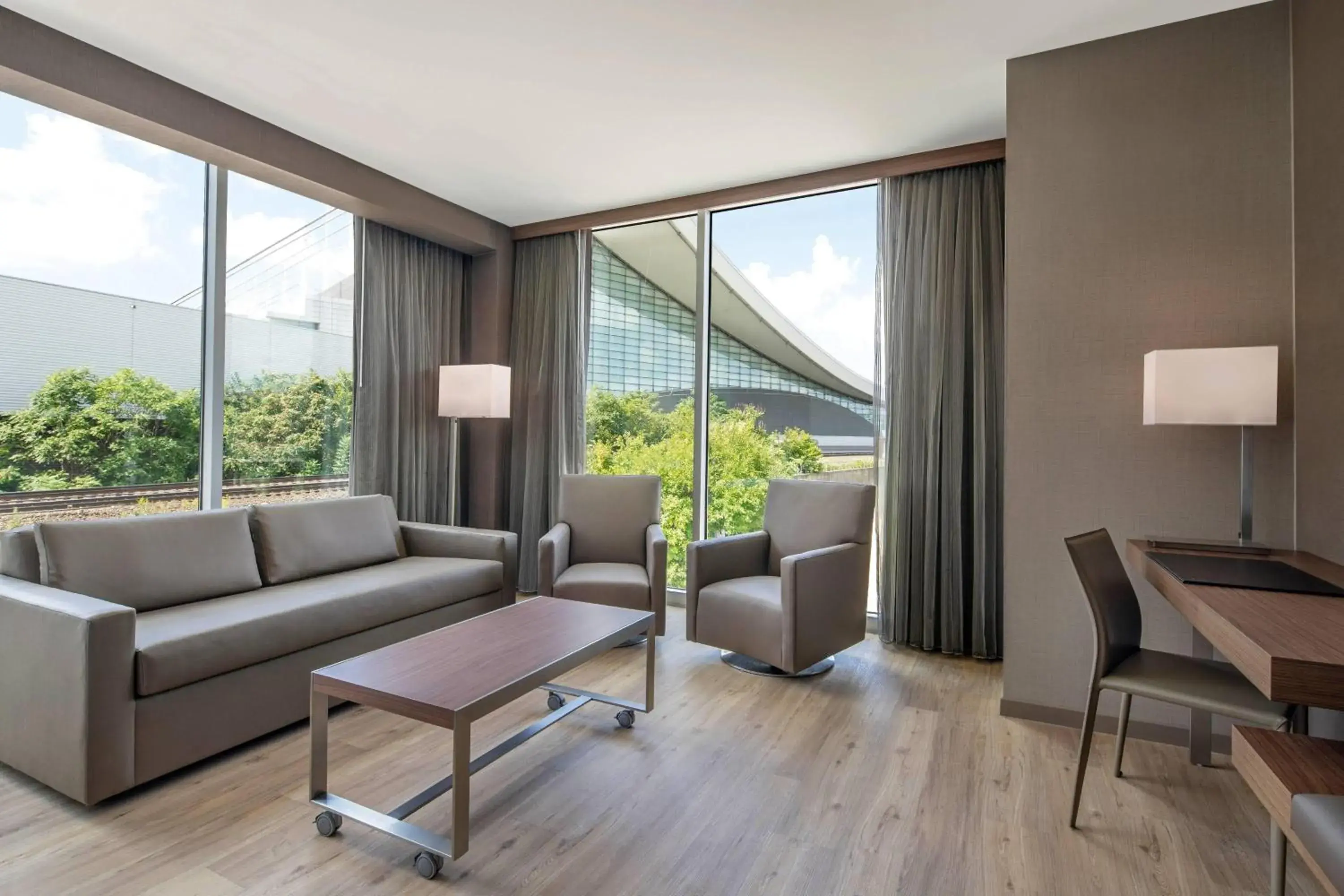 Guest Corner Room with King Bed and Sofa in AC Hotel by Marriott Pittsburgh Downtown Guest Corner Room with King Bed and Sofa in AC Hotel by Marriott Pittsburgh Downtown