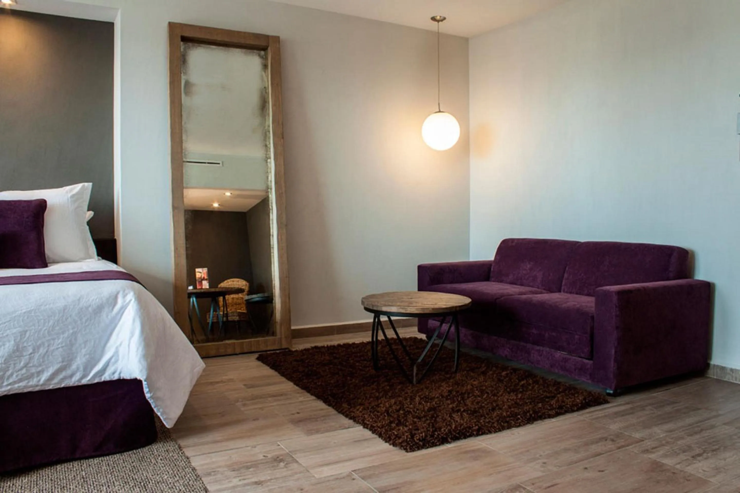 Seating area, Bed in NEhotel Nueva Estancia