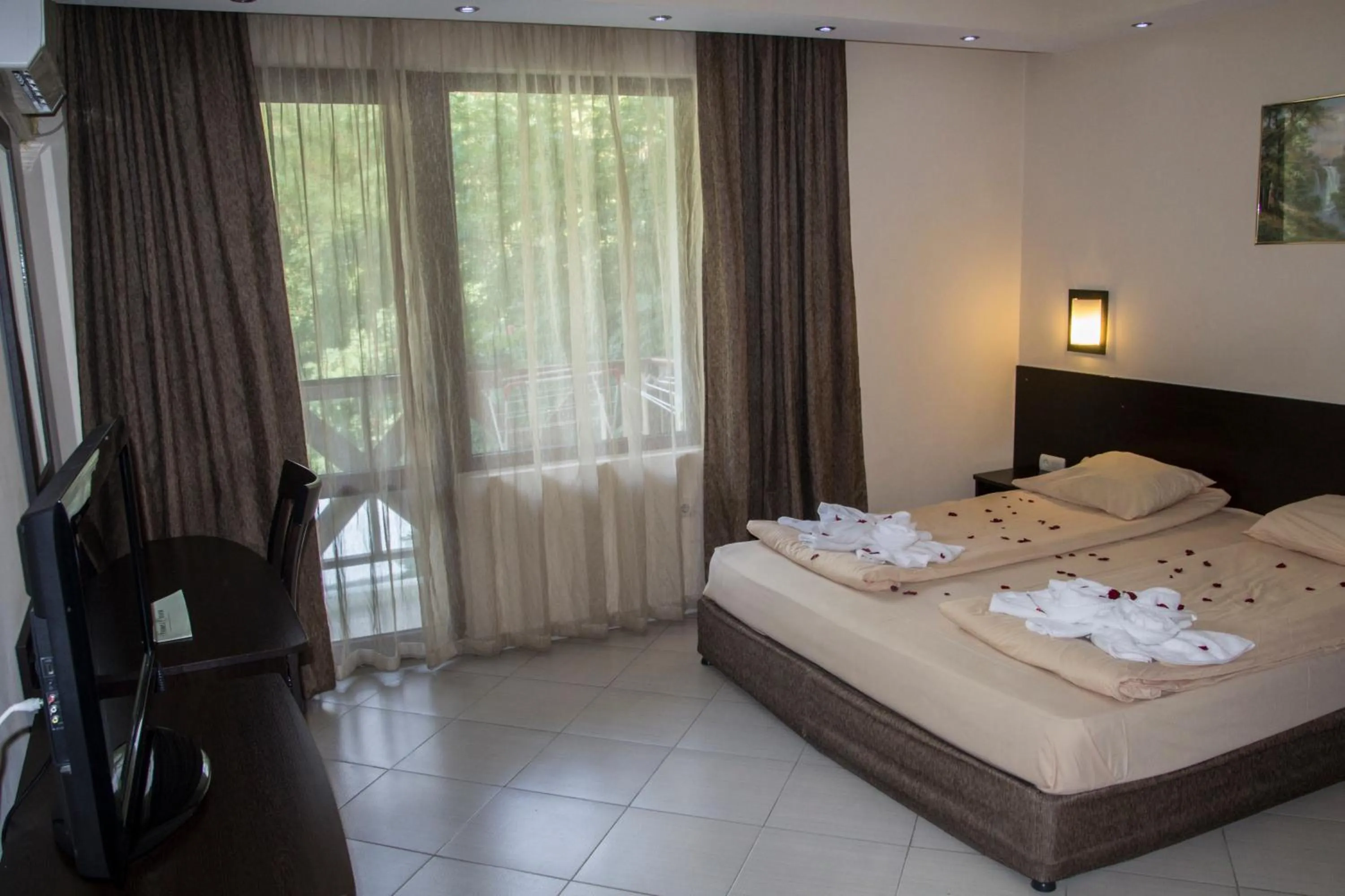 Bed in Family Hotel Delta