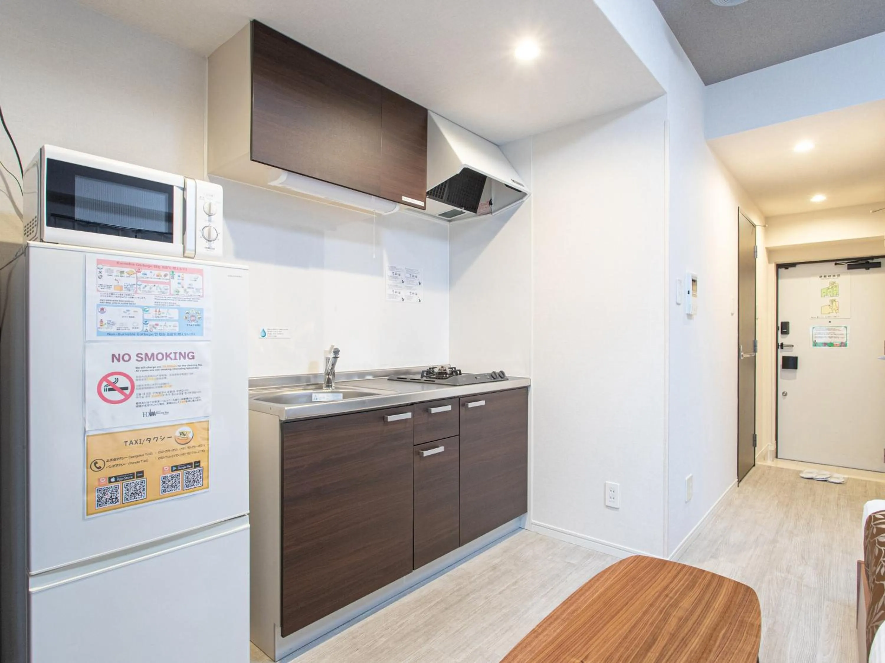 Kitchen or kitchenette in Dream Inn Hakata