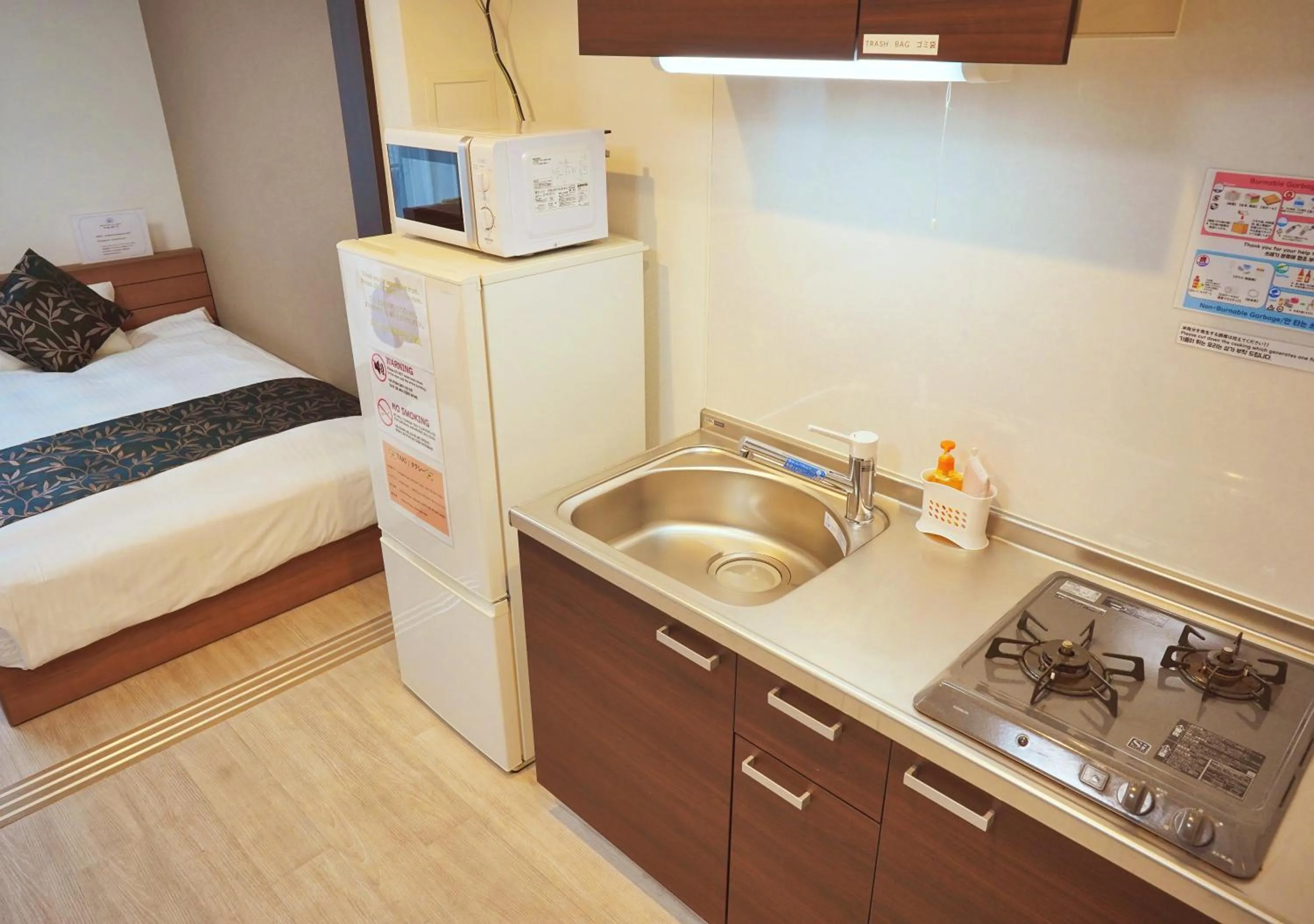 Kitchen or kitchenette, Bed in Dream Inn Hakata