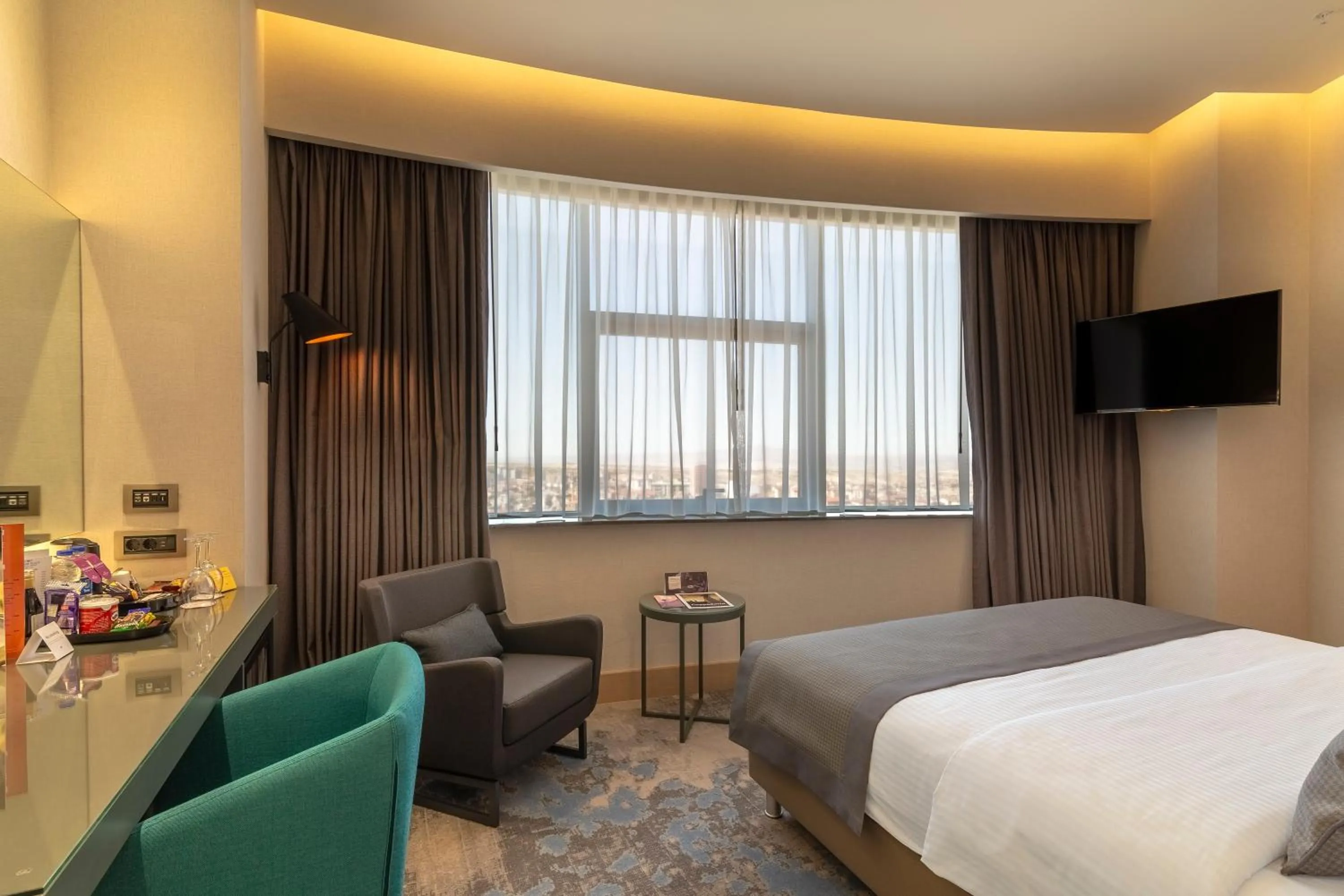 Photo of the whole room, Bed in Crowne Plaza Cappadocia - Nevsehir by IHG