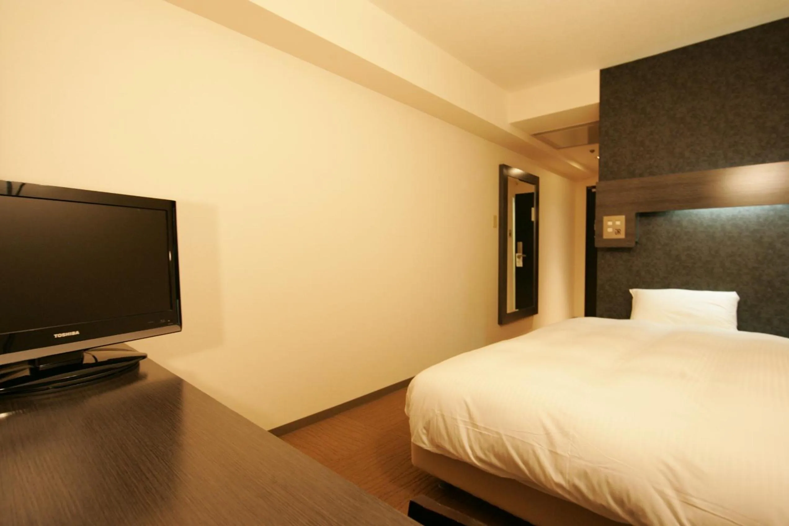 Photo of the whole room, Bed in Green Rich Hotel Nishitetsu Ohashi Ekimae