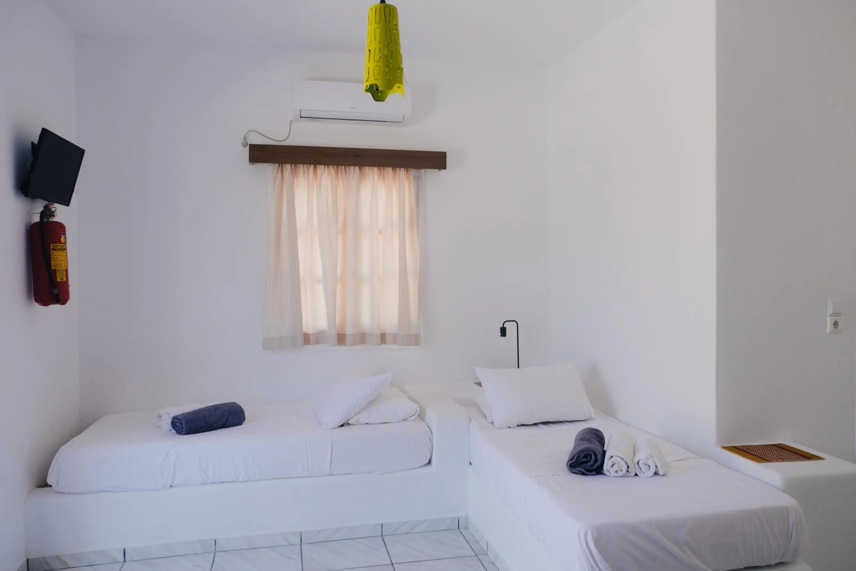 Bed in Paradise Apartments Studios