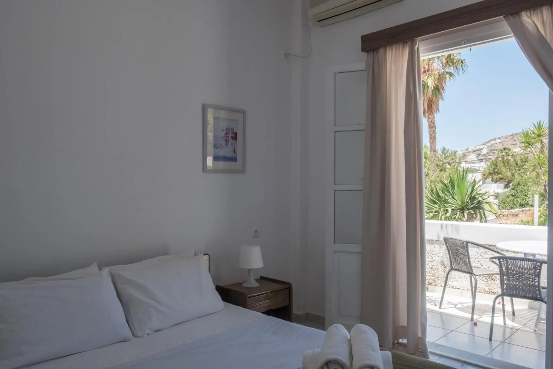 Bed in Paradise Apartments Studios