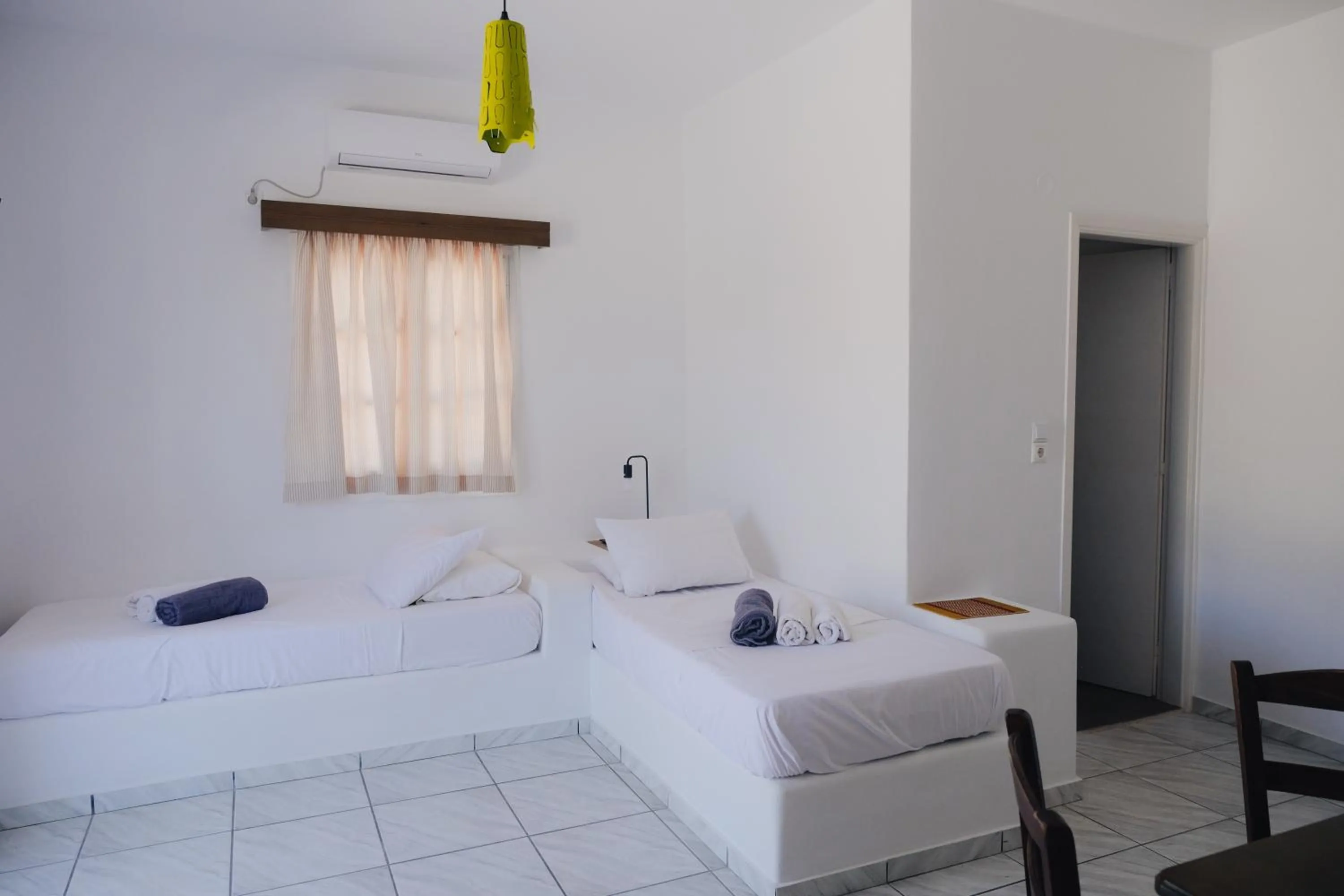 Bed in Paradise Apartments Studios