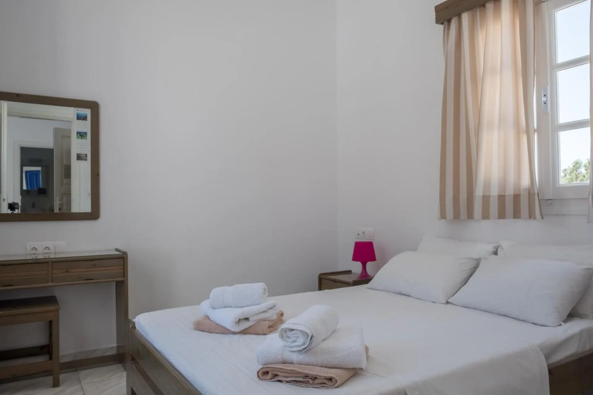 Bed in Paradise Apartments Studios