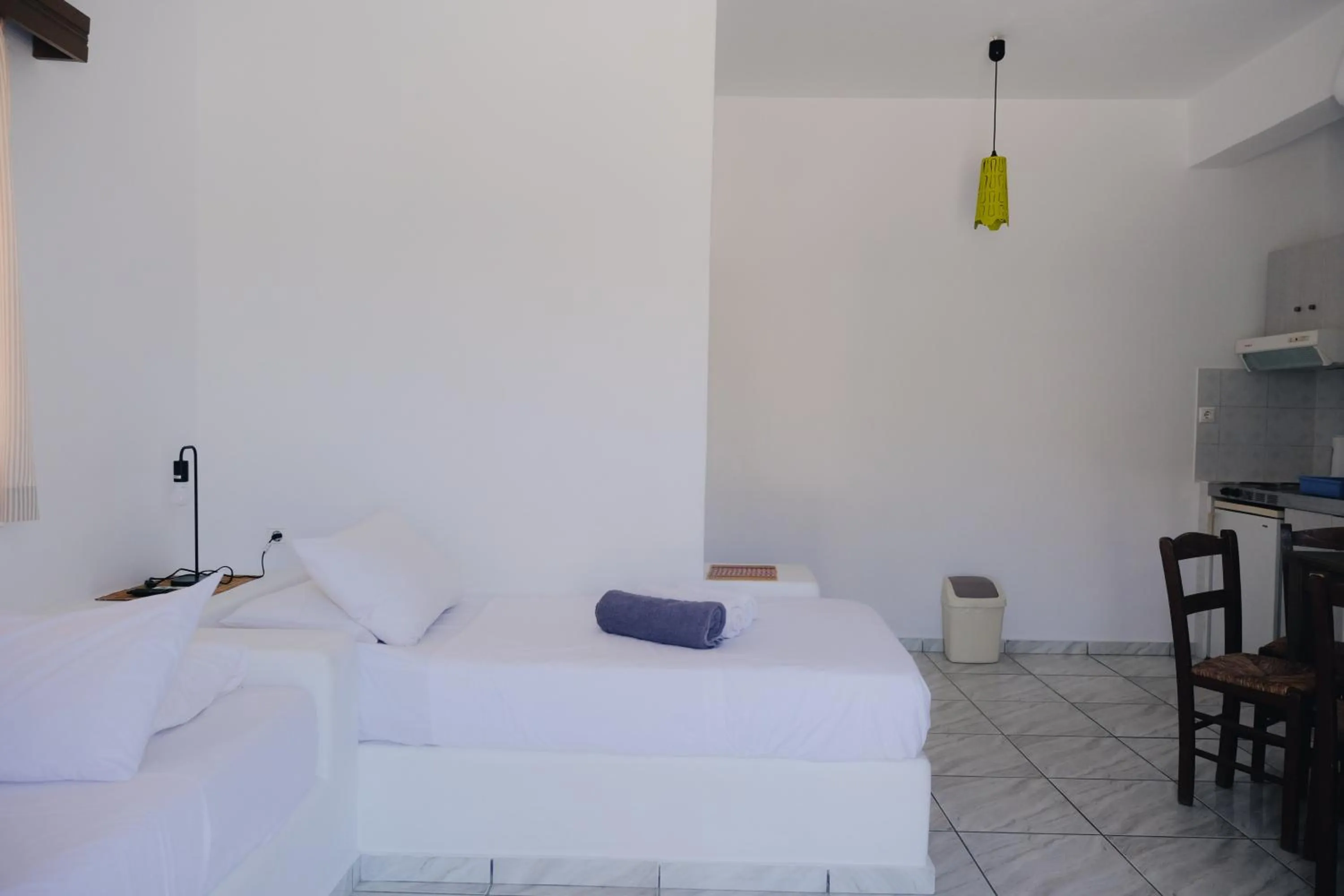 Bed in Paradise Apartments Studios