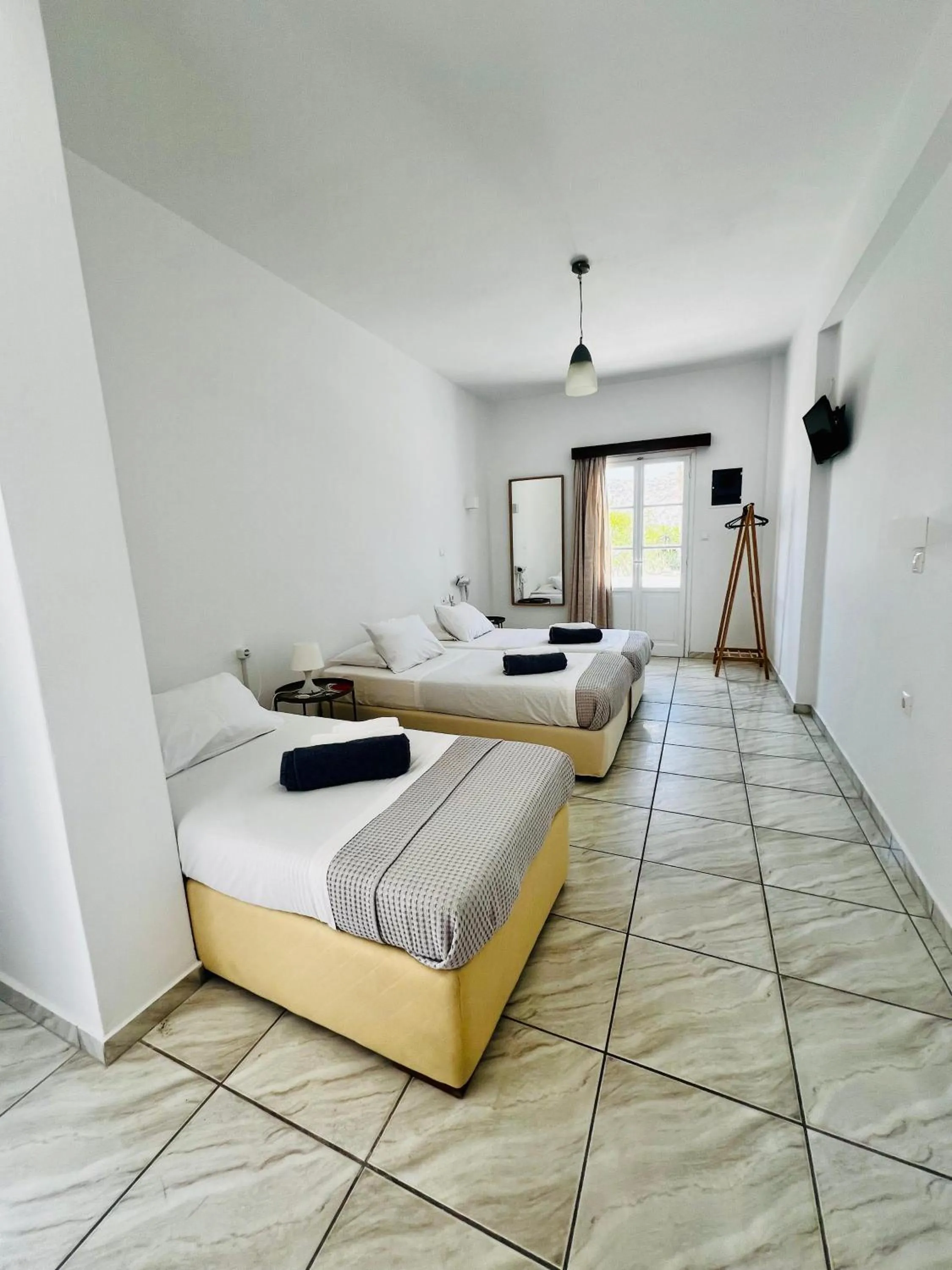 Bed in Paradise Apartments Studios