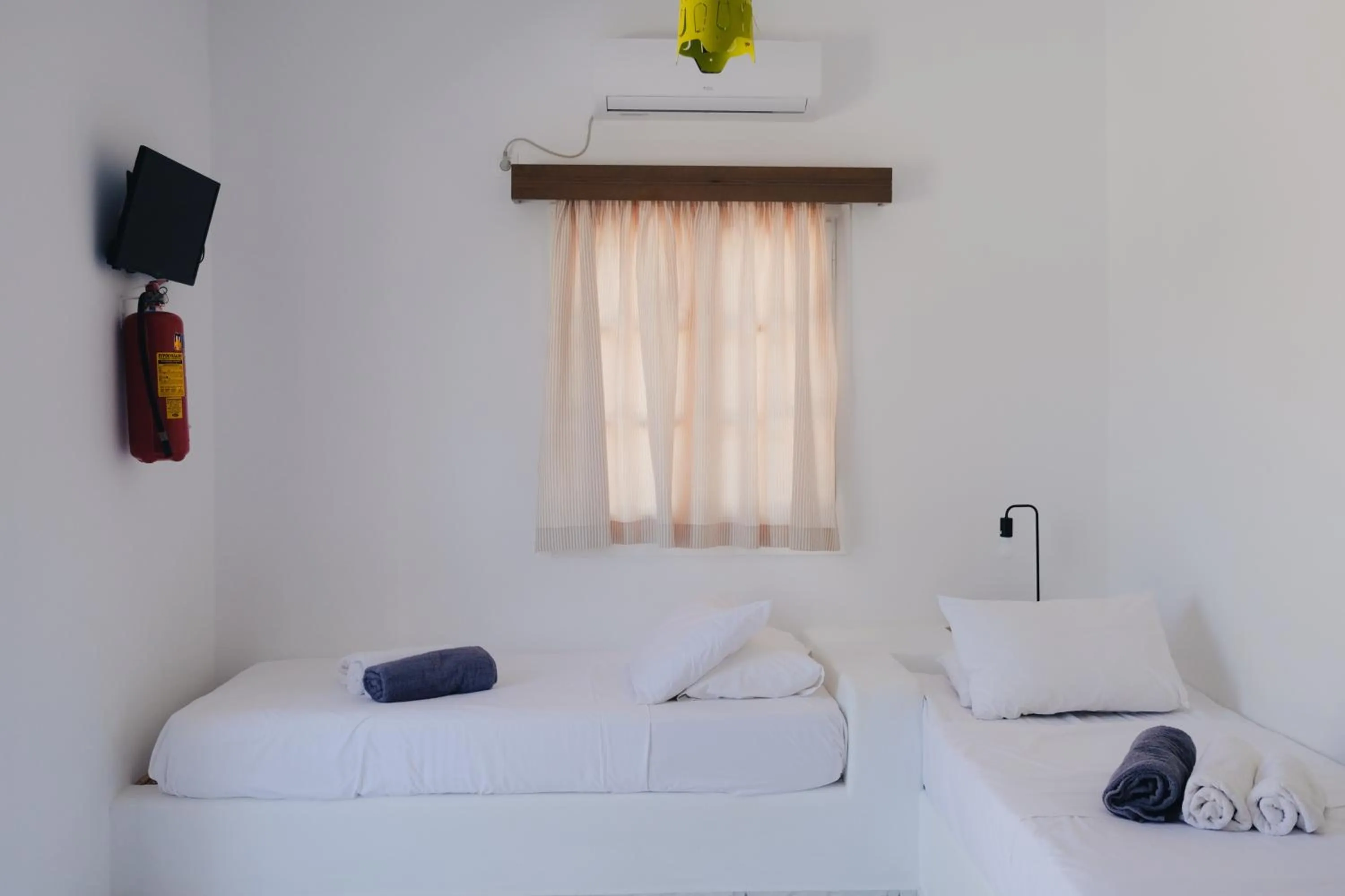 Bed in Paradise Apartments Studios