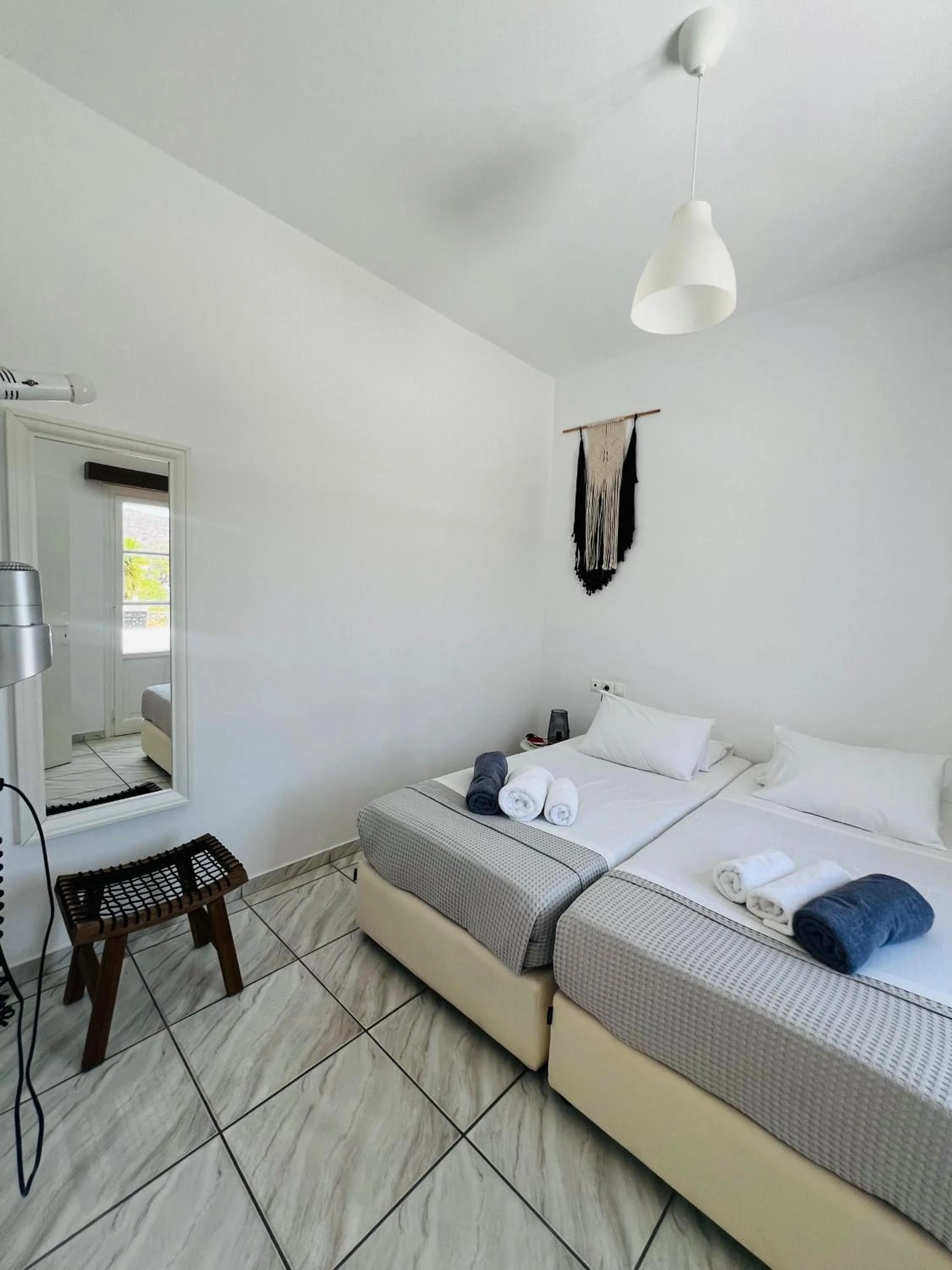 Bed in Paradise Apartments Studios