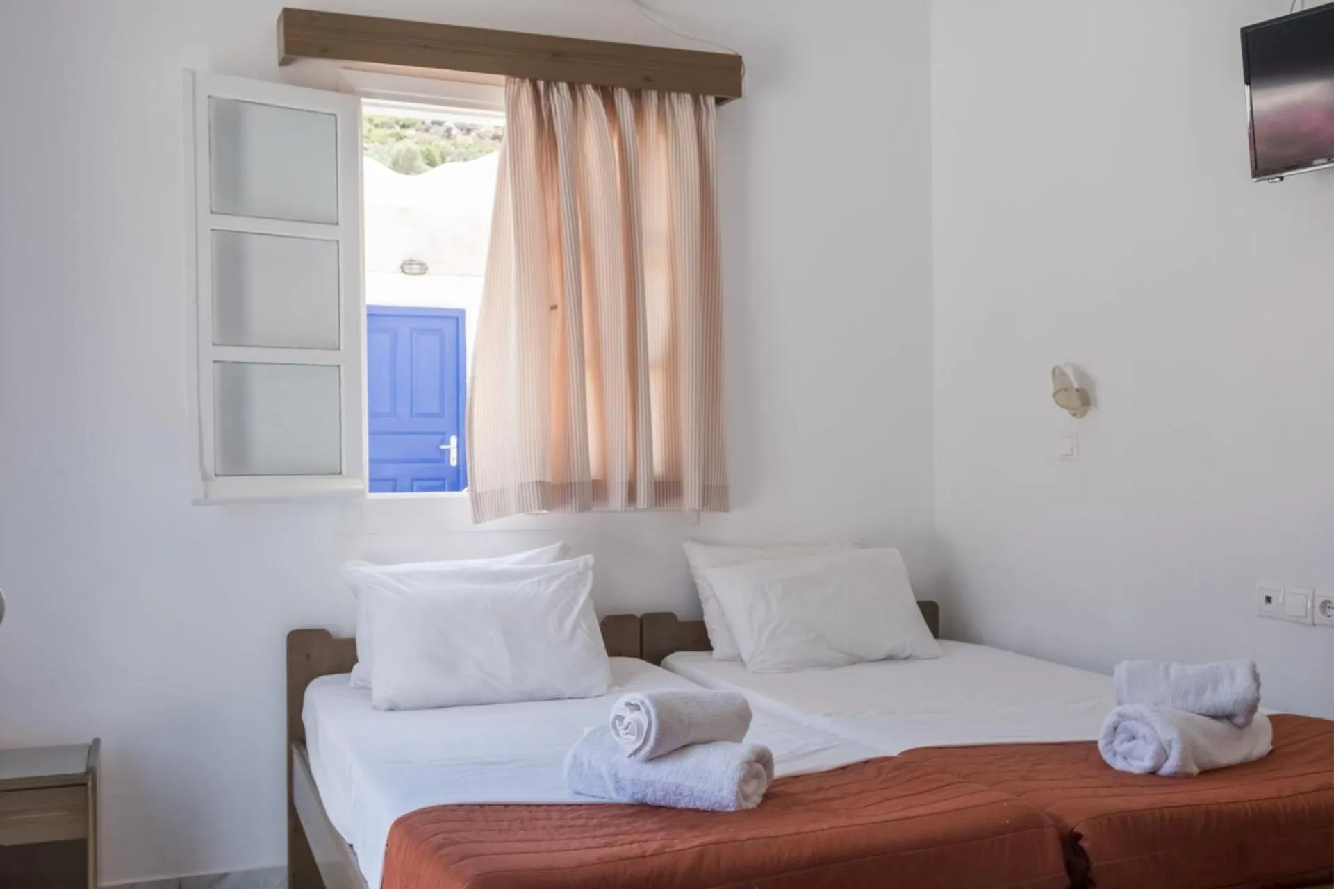 Bed in Paradise Apartments Studios