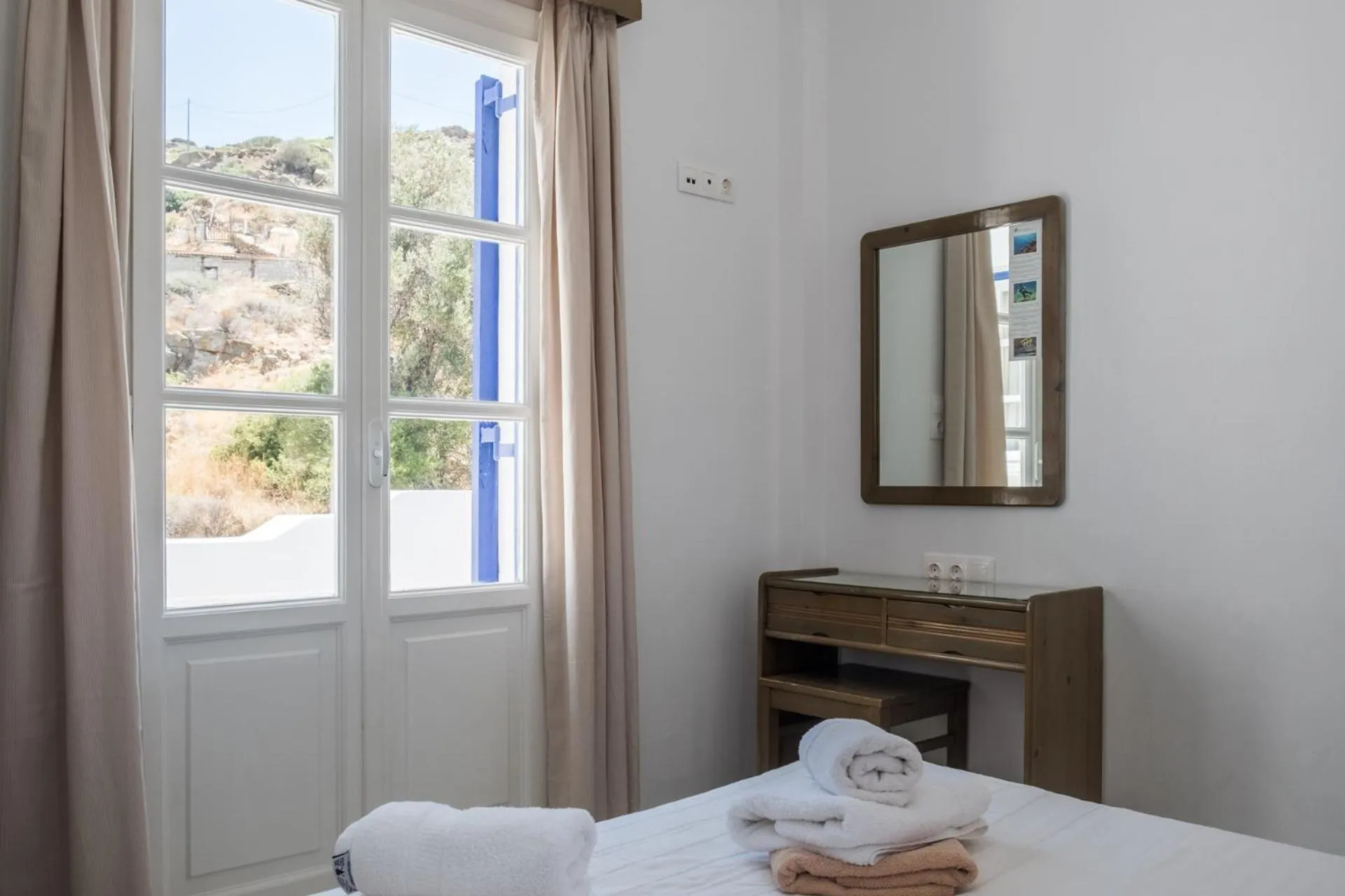 Bed in Paradise Apartments Studios