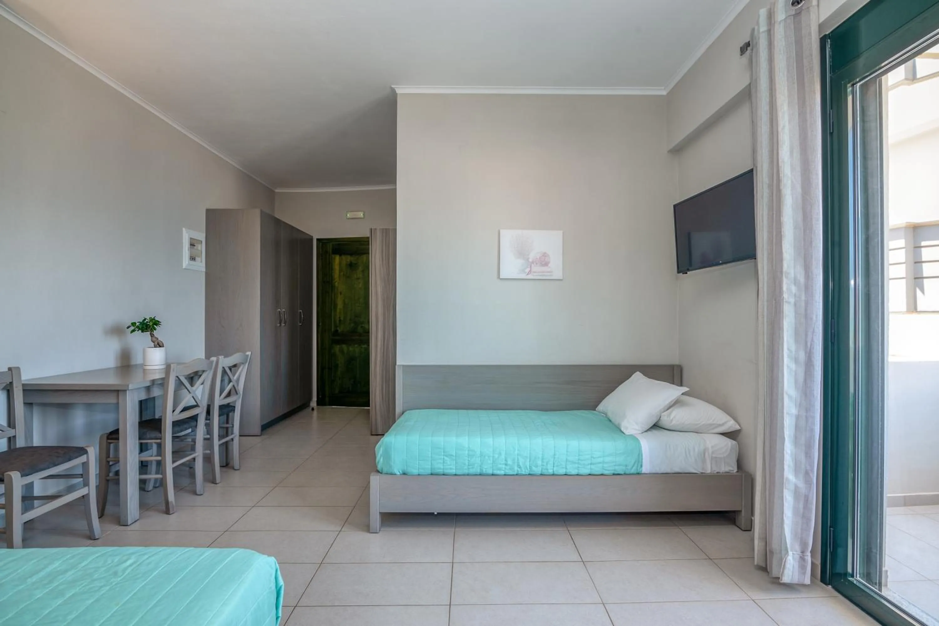 Bed in Christina Beach Hotel