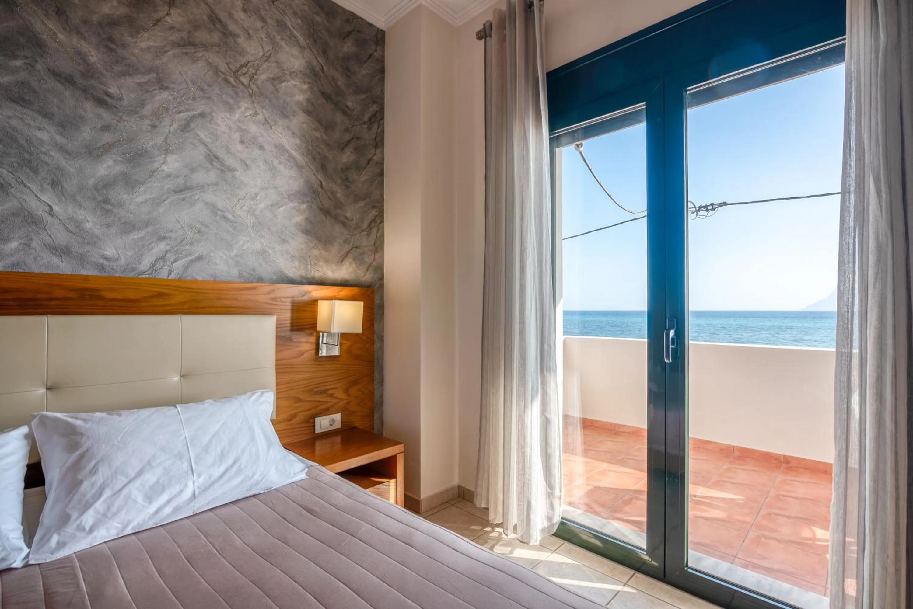 Bed in Christina Beach Hotel