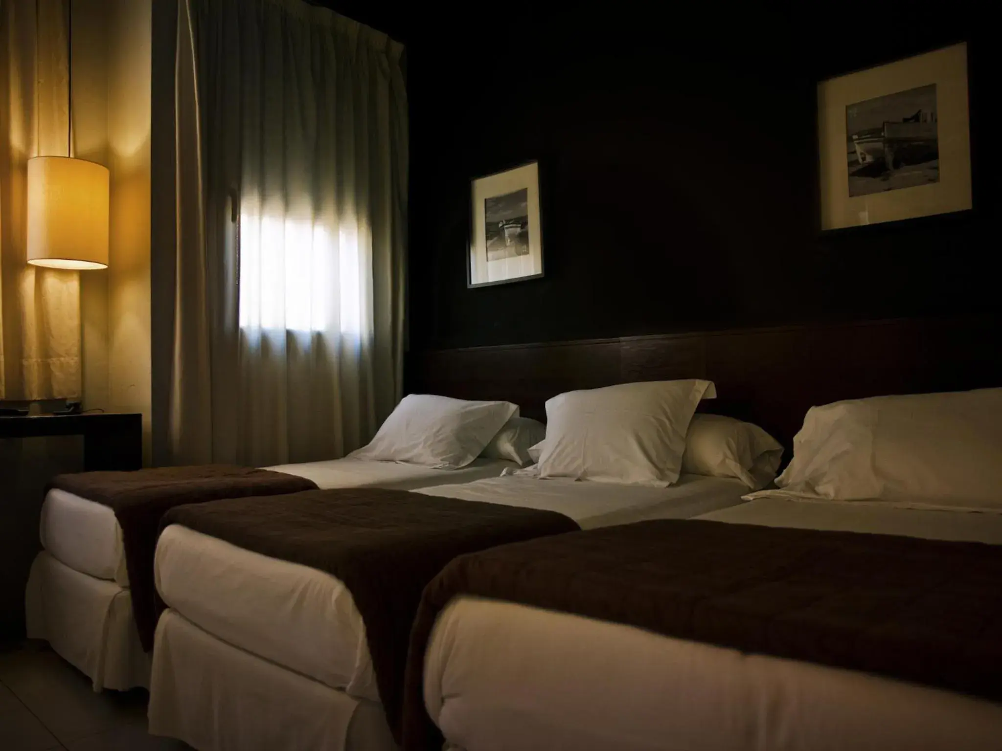 Triple Room in Hostal Badaloní Triple Room in Hostal Badaloní