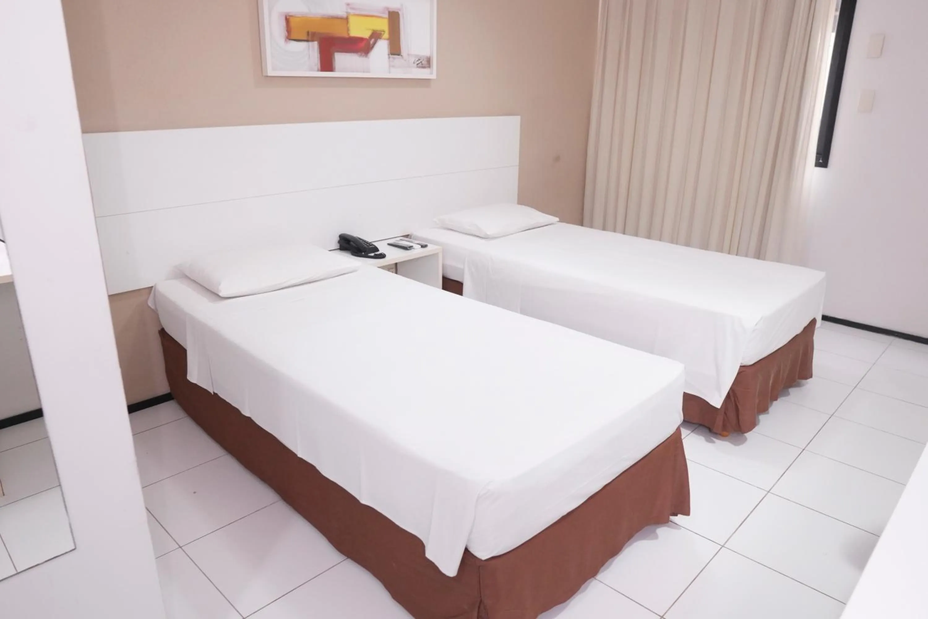Bed in SLZ Lagoa Hotel