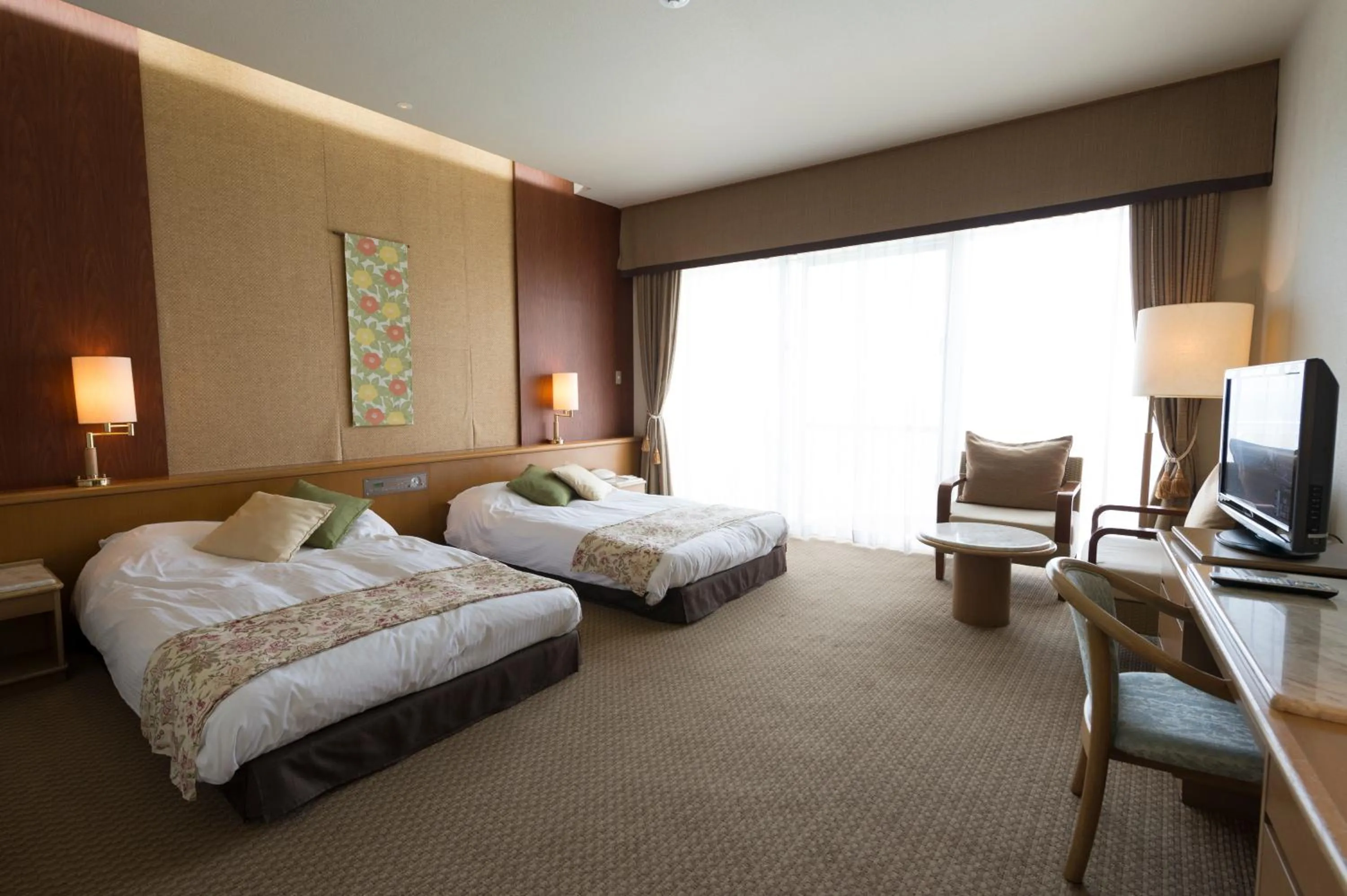 Living room, Bed in The Southern Links Resort Hotel