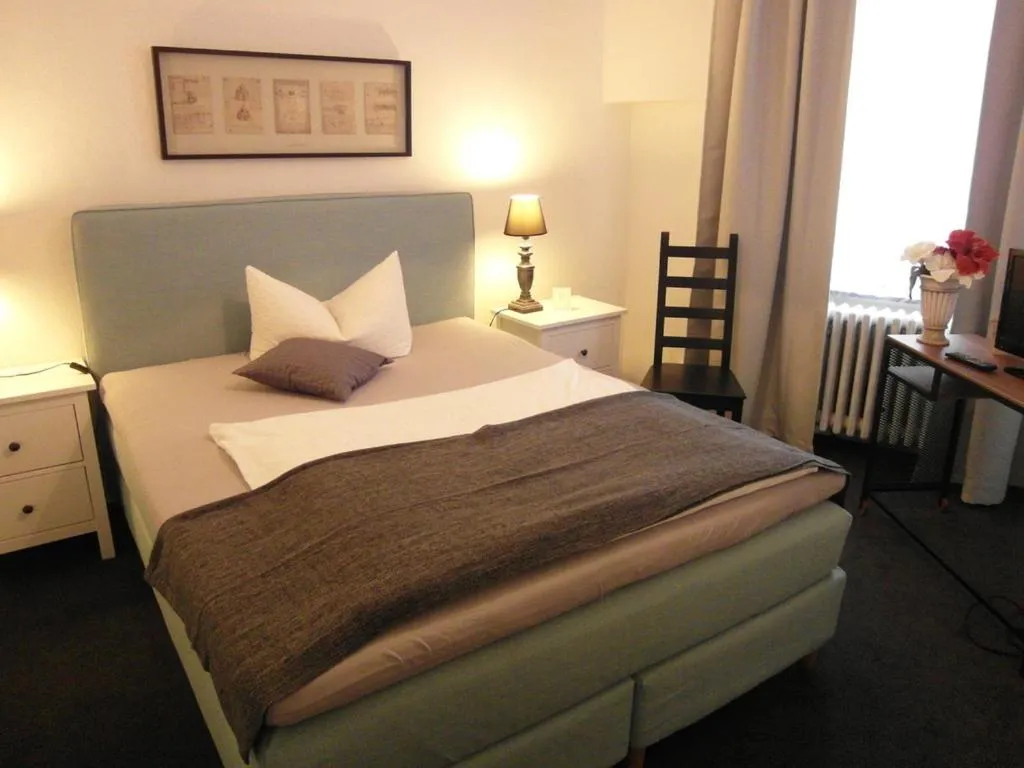 Bed in Hotel Frankfurter Hof